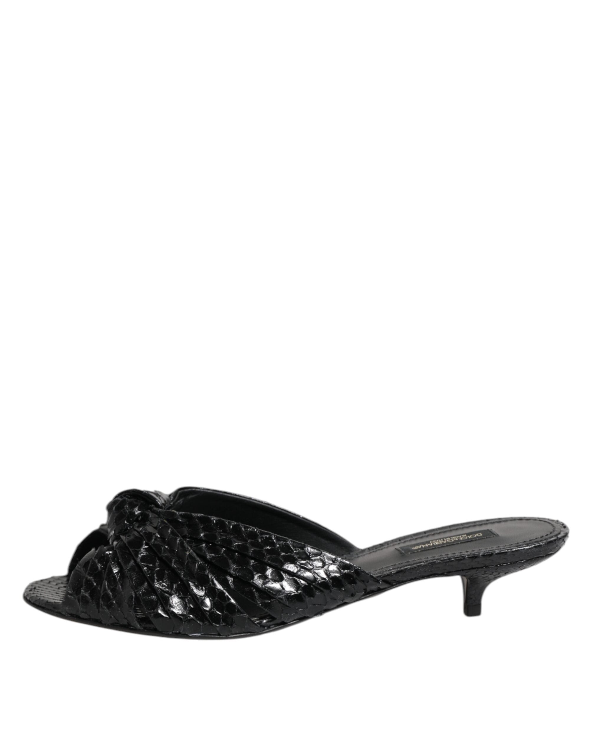 Elevate your style with Dolce & Gabbana's Black Leather Heels Slides, crafted from sumptuous python leather, embodying artisanal luxury and timeless elegance.