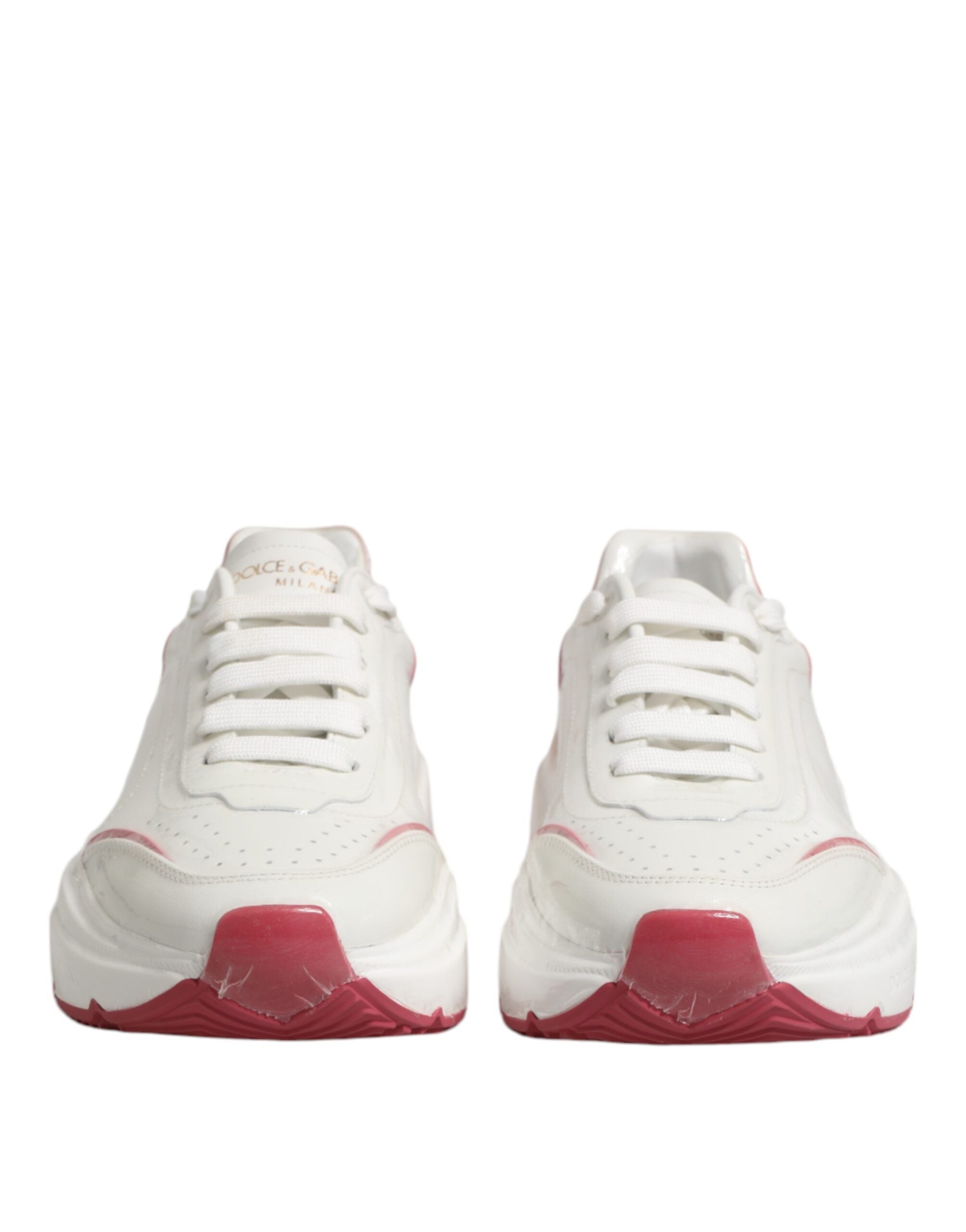 Step into the realm of luxury with Dolce & Gabbana's White Pink Daymaster Sneakers, crafted from exquisite calf leather for unparalleled elegance and comfort.