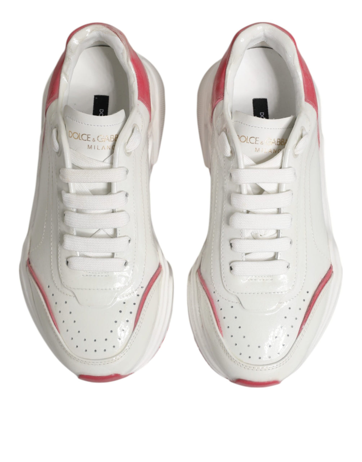 Step into refined elegance with Dolce & Gabbana's White Pink Daymaster Sneakers, crafted from premium calf leather for an exquisite blend of luxury and comfort.