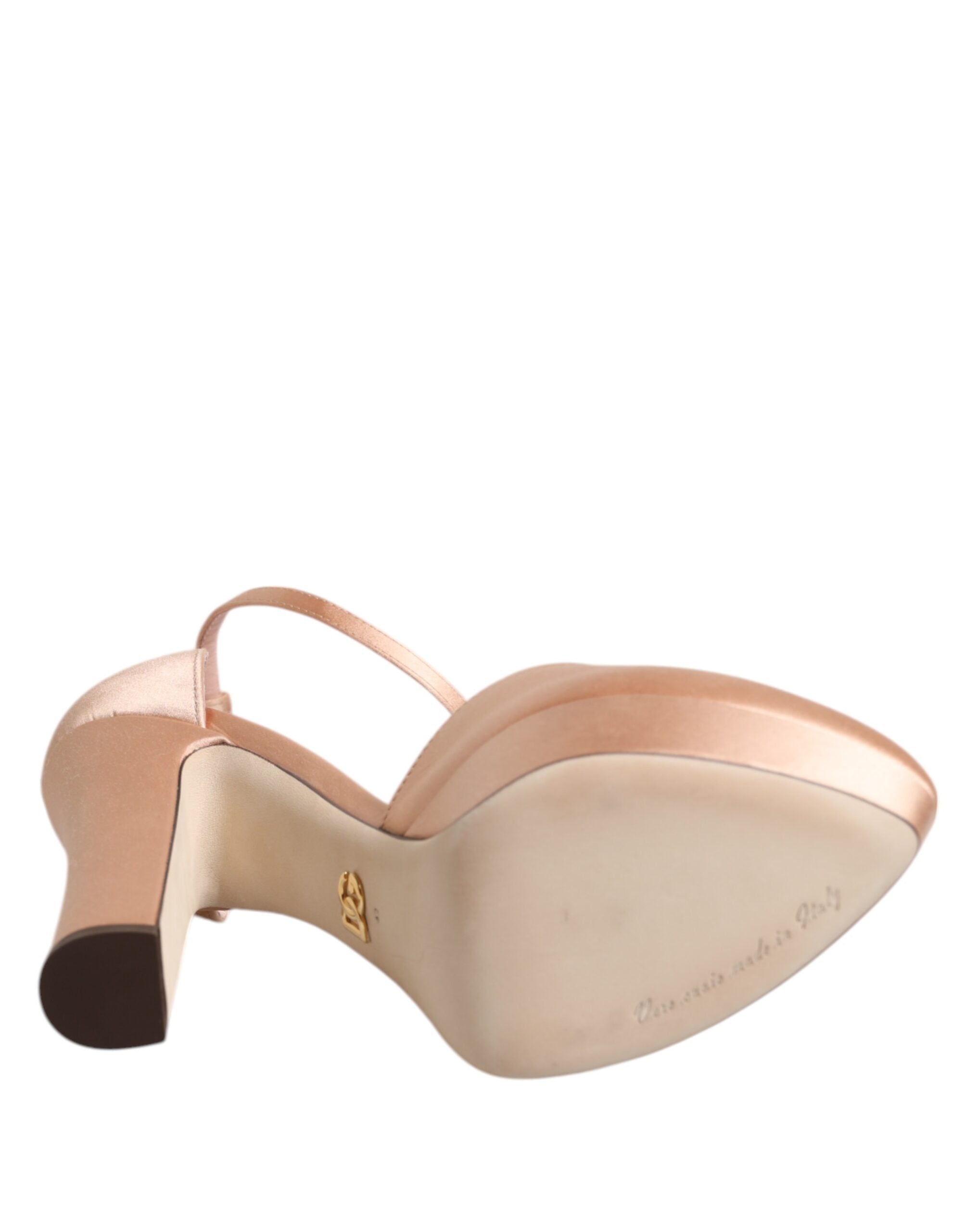 Step into opulence with Dolce & Gabbana Pink Block Heels, crafted in Italy from a luxurious blend of viscose and silk, embodying timeless elegance and exquisite floral artistry.