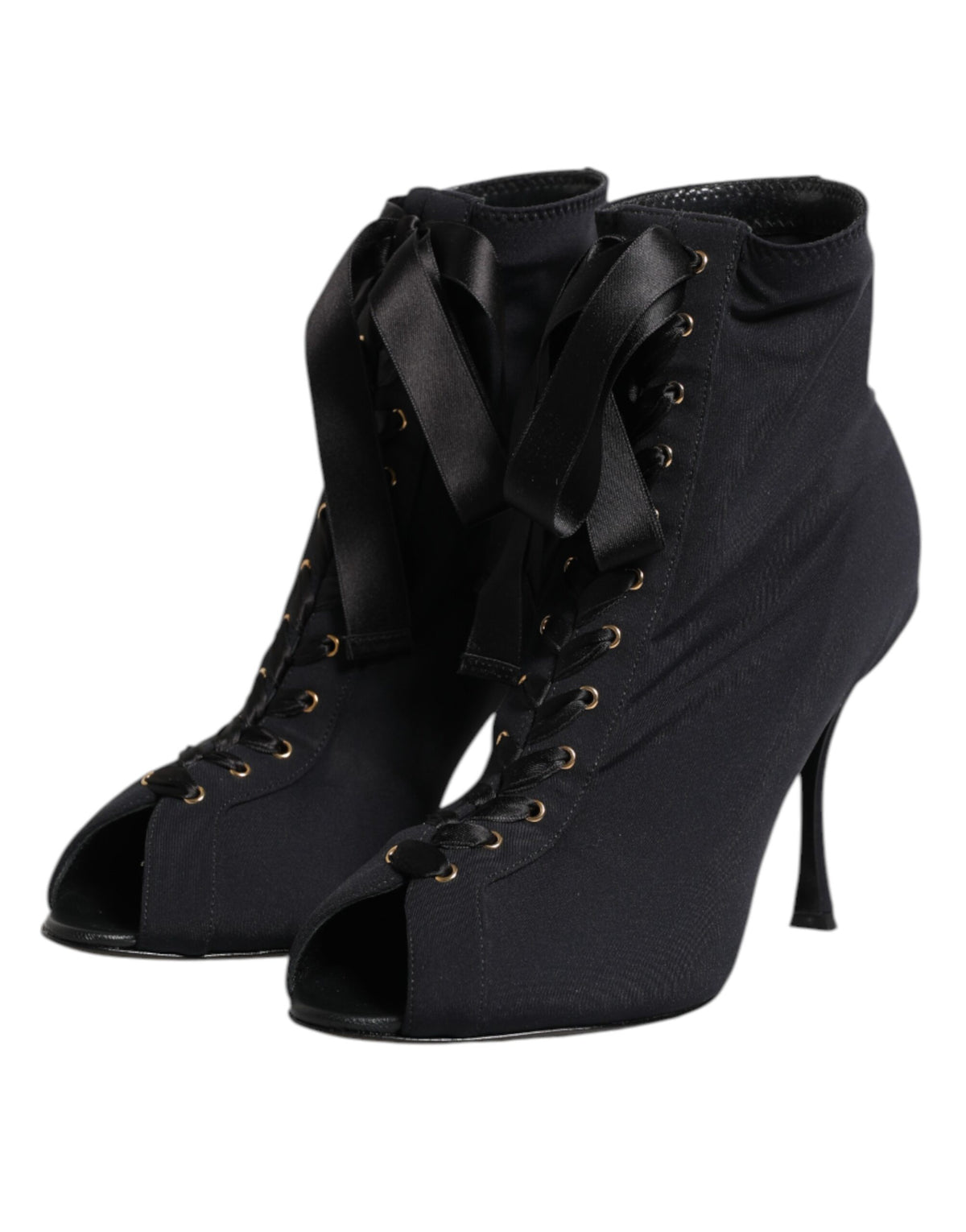 Step into a realm of elegance with Dolce & Gabbana's Black Stiletto Heels Lace Up Boots, where exquisite craftsmanship meets luxurious design, perfect for the discerning individual.