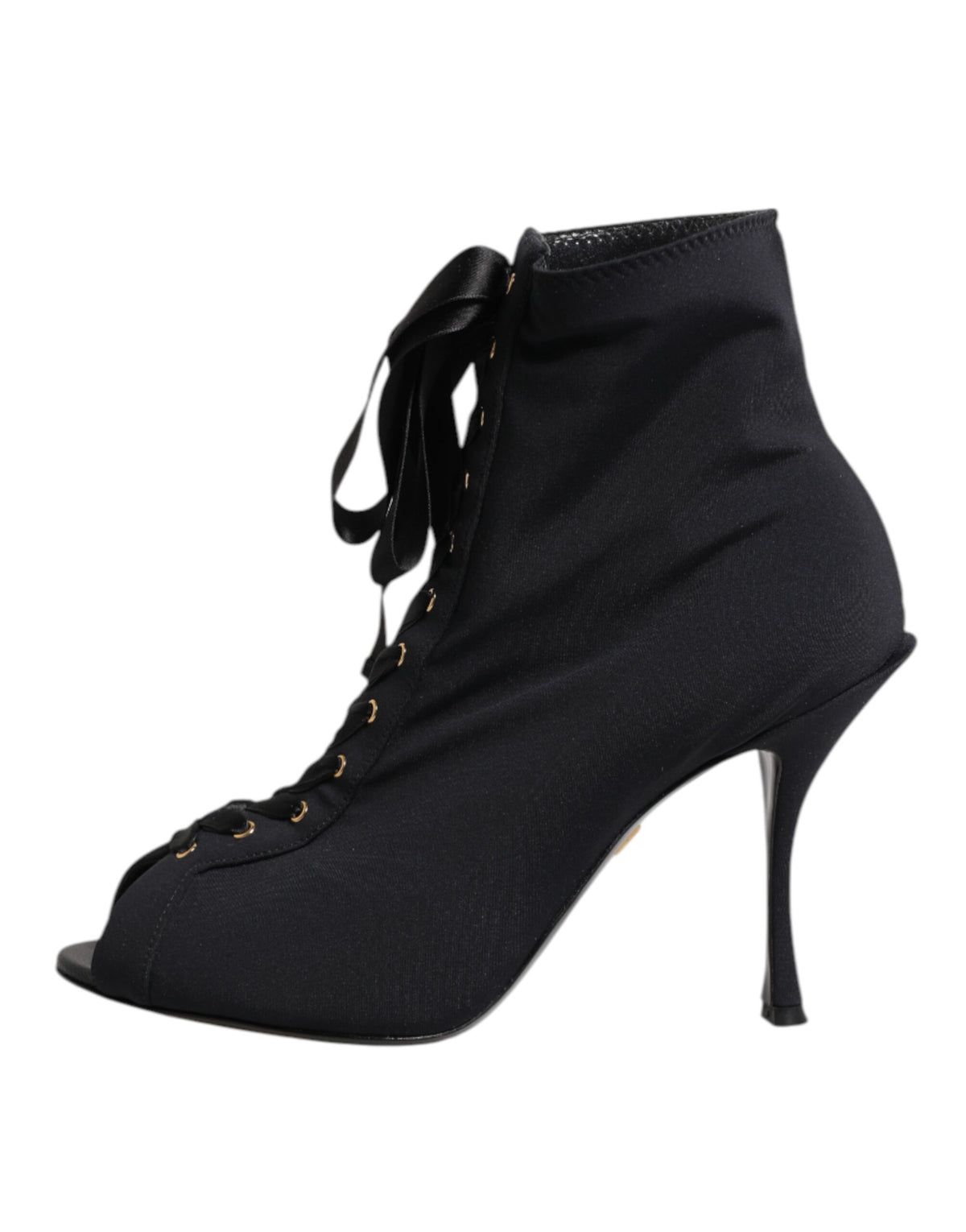 Step into a world of elegance with Dolce & Gabbana's Black Stiletto Heels Lace Up Boots, crafted in Italy from luxurious materials for a timeless allure.