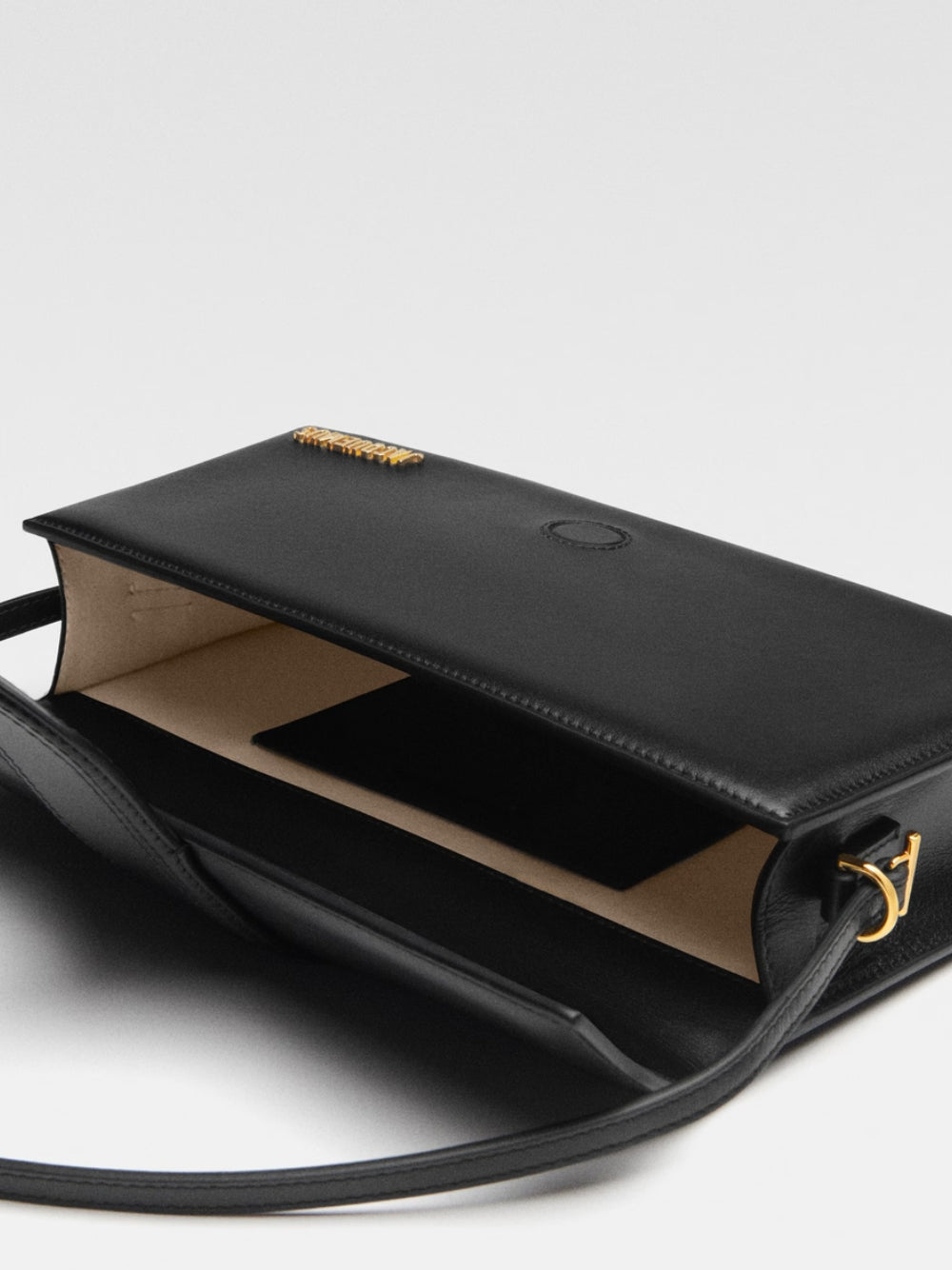 Discover the Jacquemus Black Leather Le Bambino Long, a timeless luxury piece crafted from authentic leather, embodying sophistication and elegance for the discerning individual.