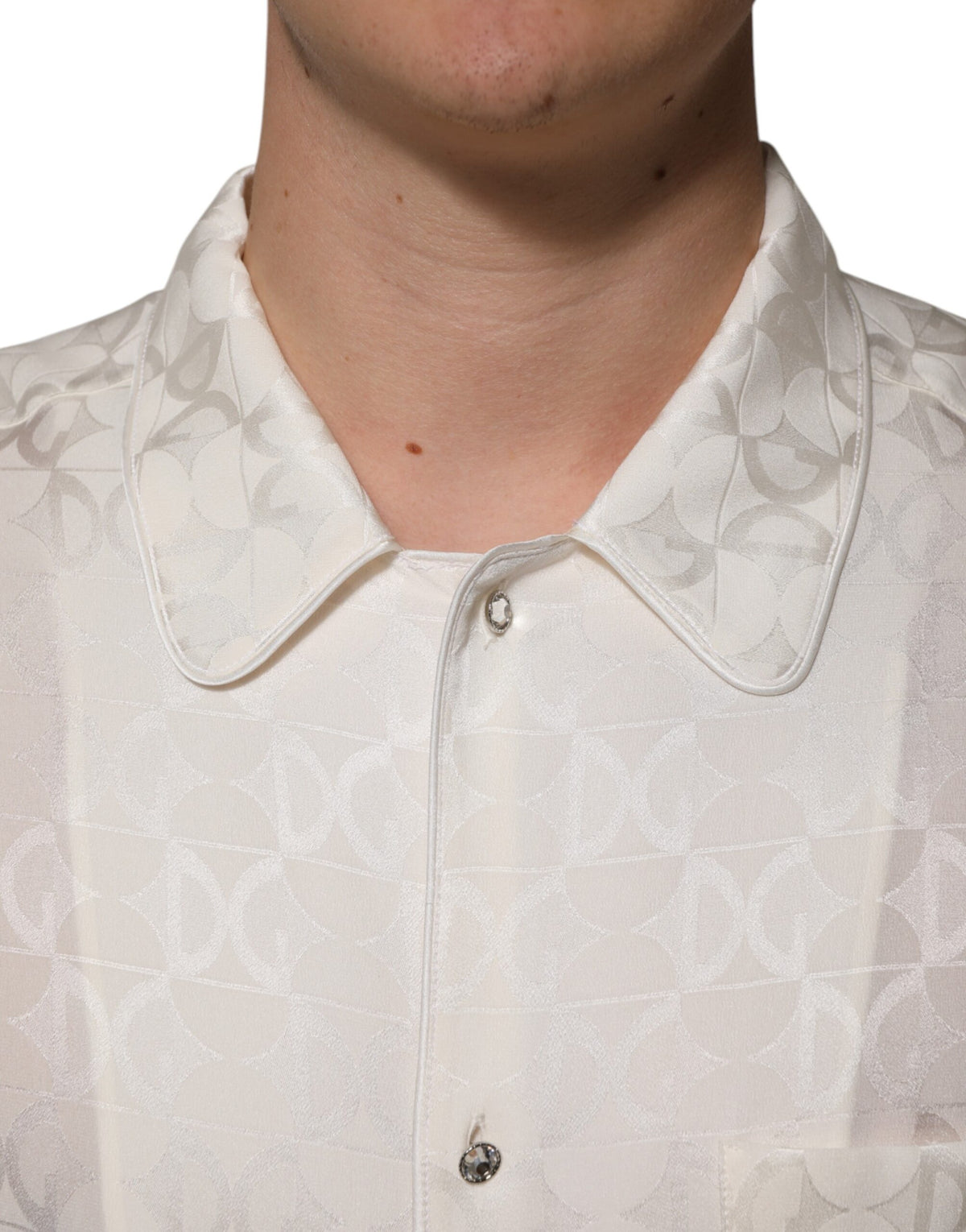 Indulge in the exquisite Dolce & Gabbana White Silk DG Logo Print Long Sleeves Shirt, a testament to Italian craftsmanship that elevates your elegance and sophistication.