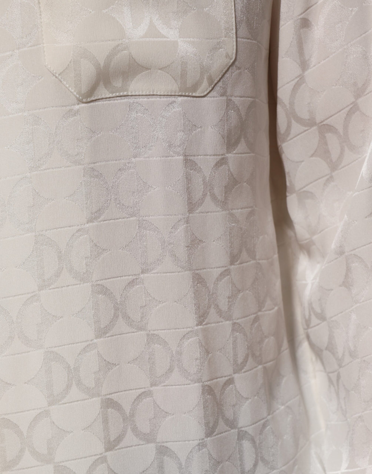 Elevate your wardrobe with the Dolce & Gabbana White Silk DG Logo Print Long Sleeves Shirt, a testament to Italian craftsmanship and timeless elegance, perfect for sophisticated occasions.
