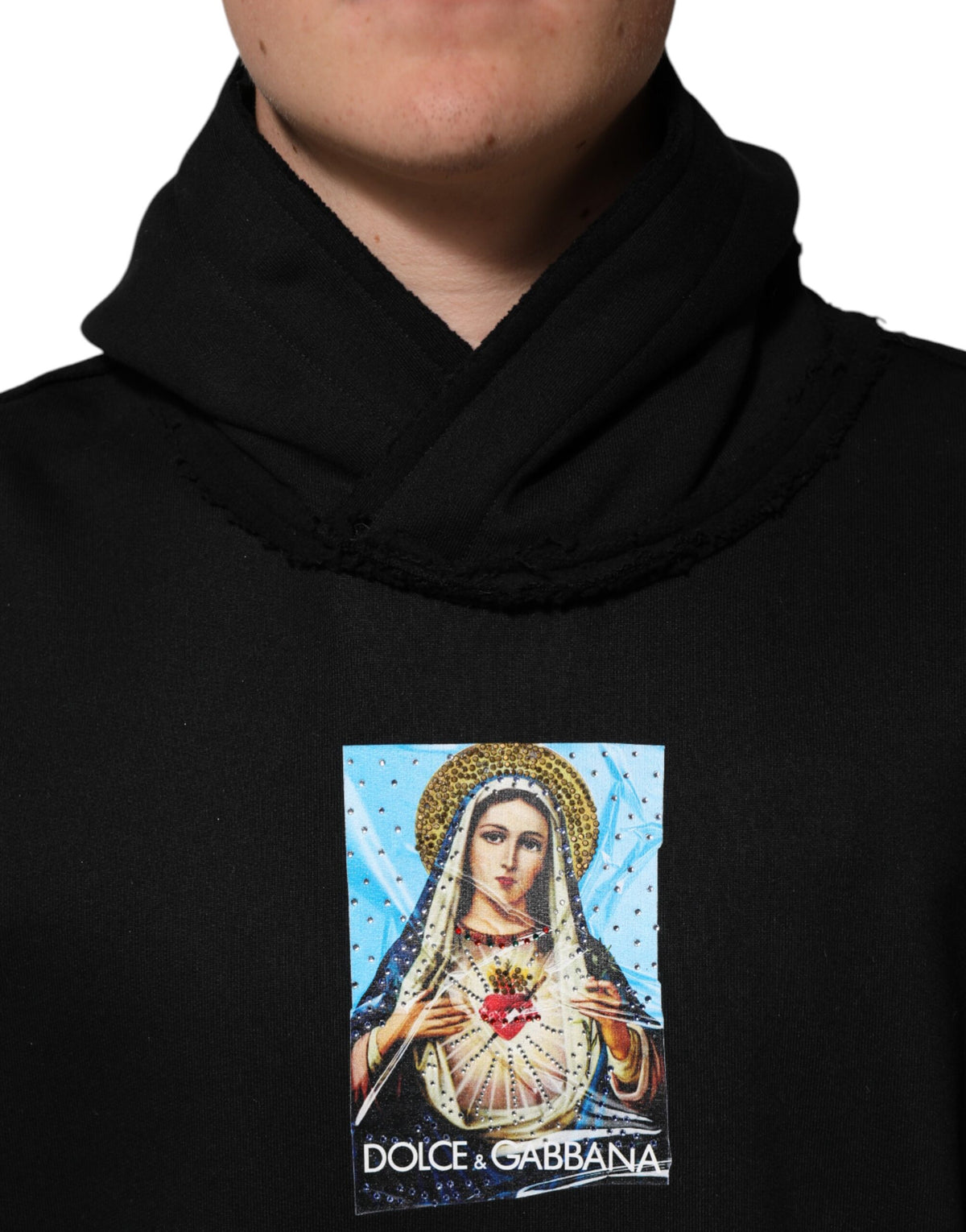 Indulge in the exquisite Dolce & Gabbana Black Printed Hoodie, a luxurious cotton masterpiece adorned with crystal embellishments, perfect for elevating any occasion with effortless elegance.