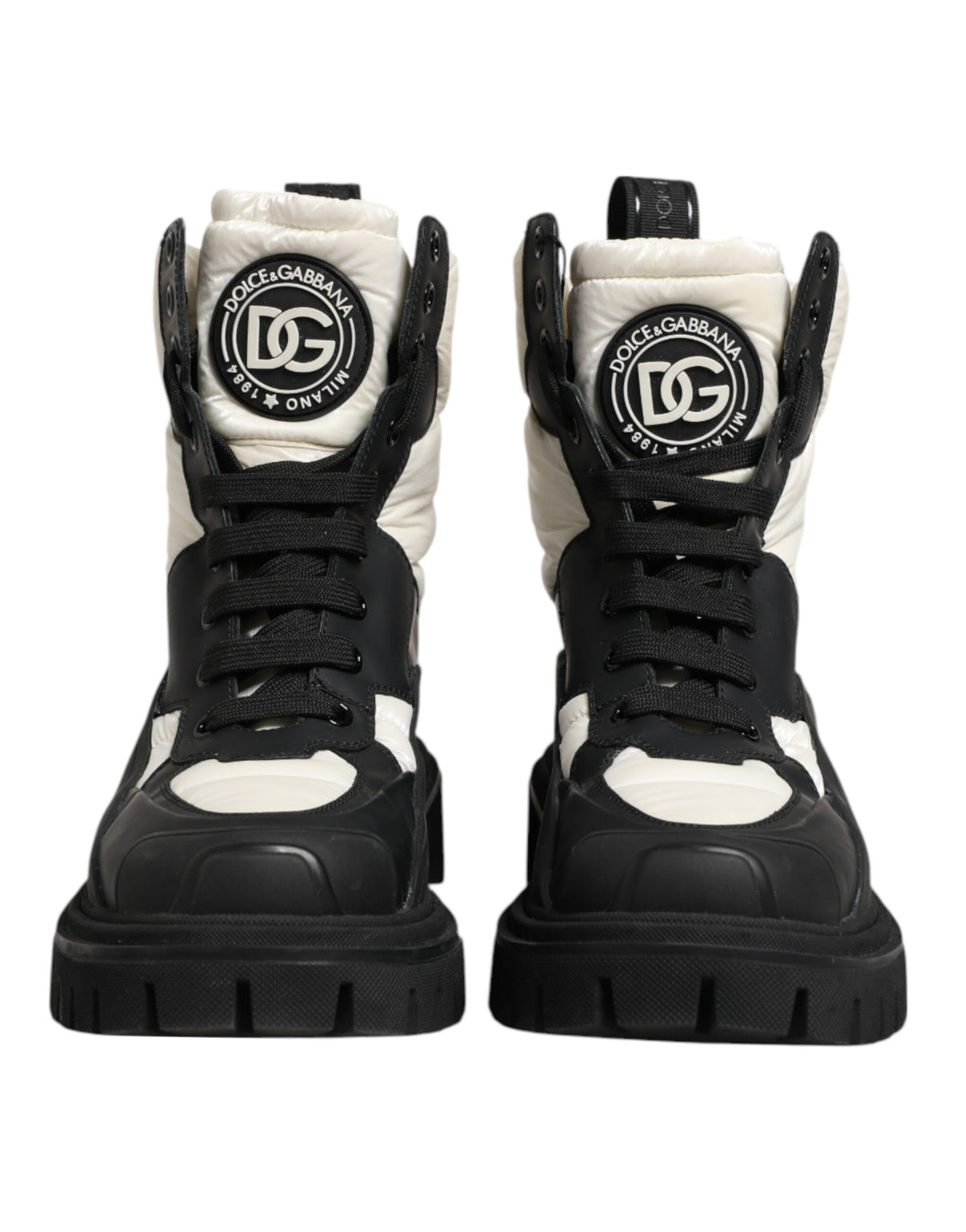 Step into luxury with Dolce & Gabbana's Black White Padded Mid Calf Lace Up Boots, crafted in Italy from premium polyester, embodying bold elegance for the discerning individual.