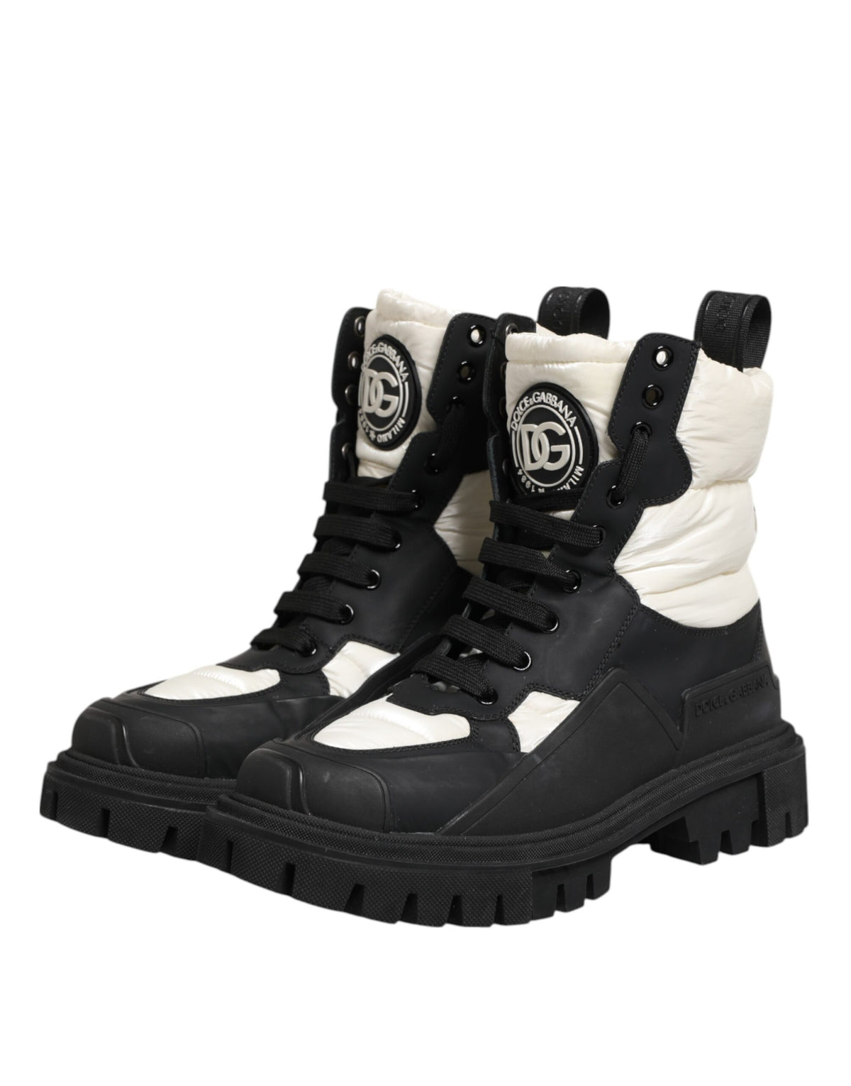 Step into luxury with Dolce & Gabbana's Black White Padded Mid Calf Lace Up Boots, crafted in Italy from premium polyester, embodying bold elegance and timeless allure.