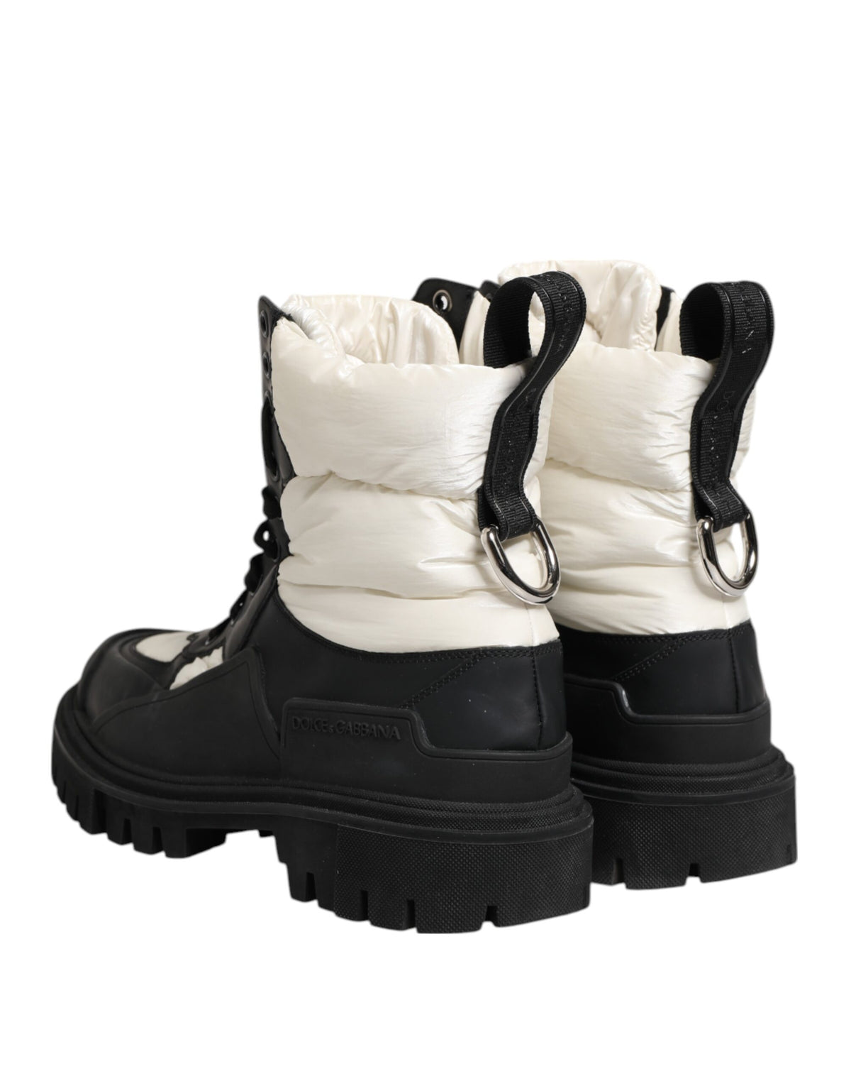 Step into luxury with Dolce & Gabbana's Black White Padded Mid Calf Lace Up Boots, crafted in Italy from premium polyester, embodying bold elegance and timeless allure.