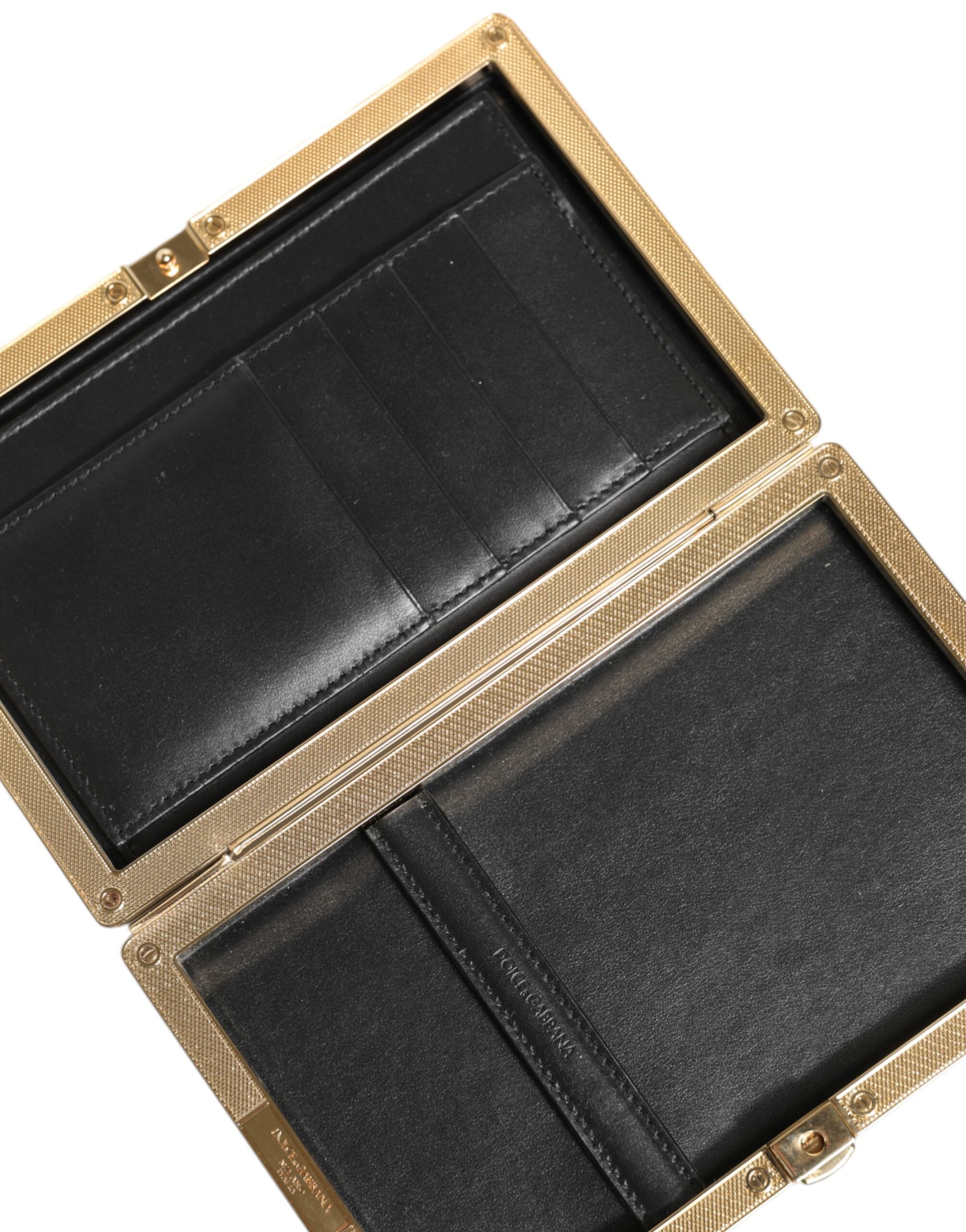Indulge in the exquisite Dolce & Gabbana Black Leather Gold Frame Clutch, a timeless accessory crafted from luxurious goat leather, perfect for elevating any evening ensemble.