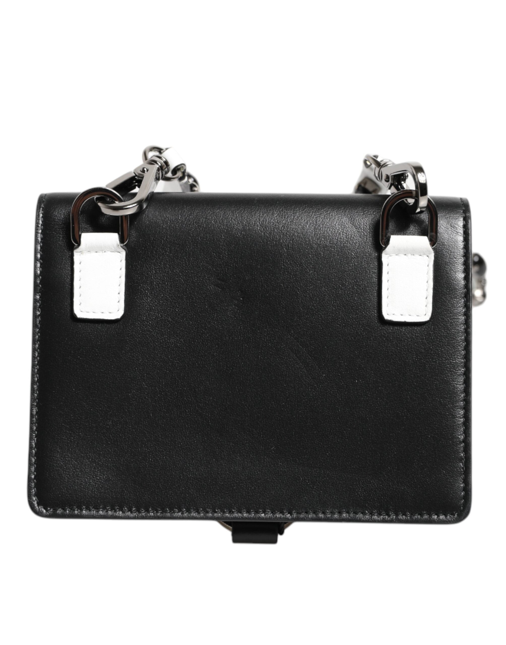 Indulge in the exquisite Dolce & Gabbana Black Leather Crystal Embellished Card Holder Wallet, a symbol of luxury and craftsmanship, designed for the discerning individual.