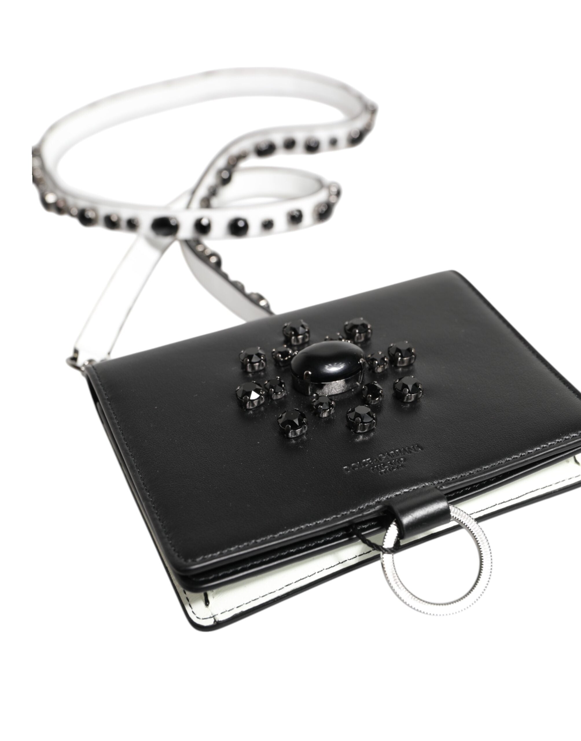 Indulge in the exquisite allure of the Dolce & Gabbana Black Leather Crystal Embellished Card Holder Wallet, a symbol of luxury and refined craftsmanship, perfect for the discerning individual.
