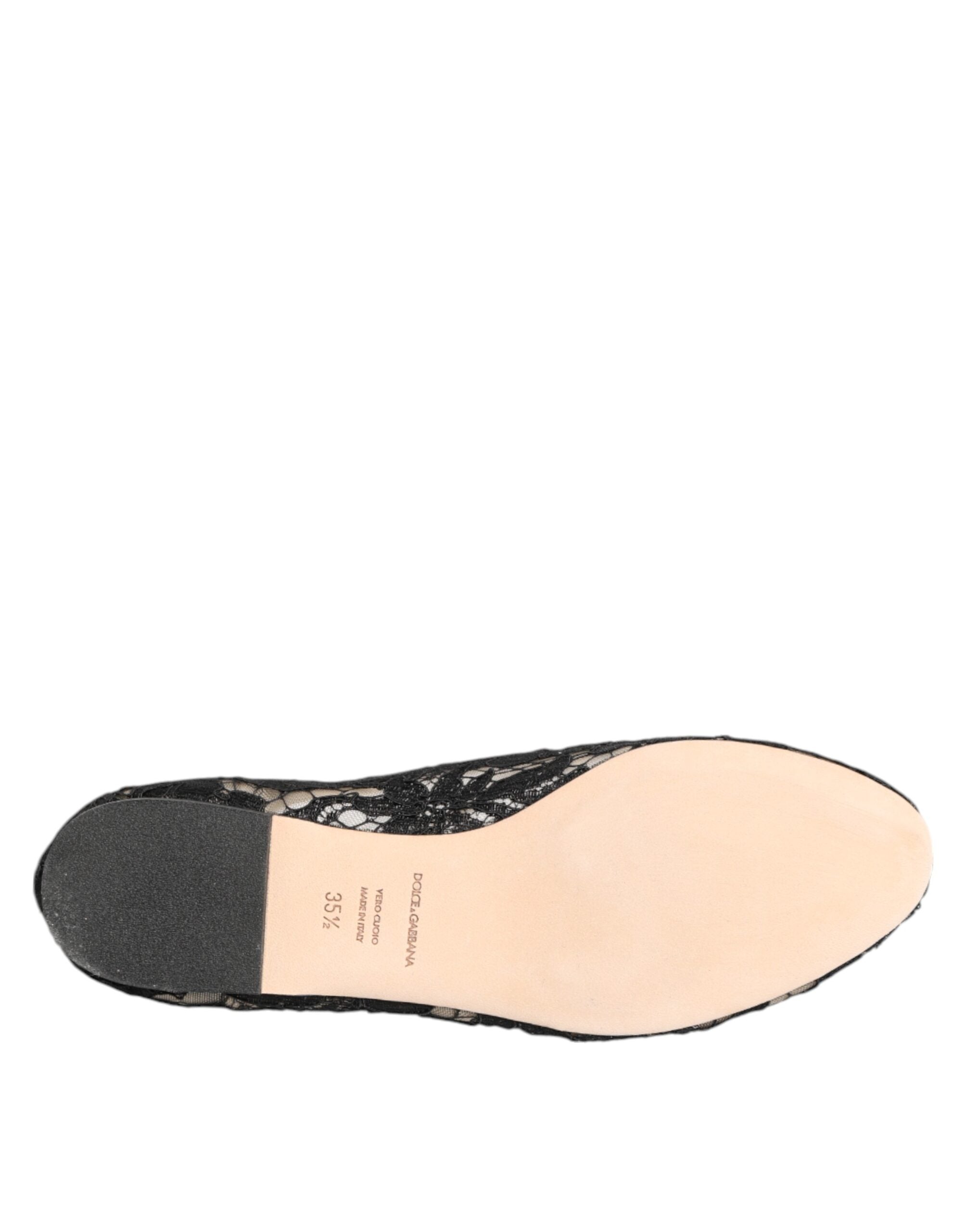 Indulge in the exquisite allure of Dolce & Gabbana's Black Taormina Lace Flats, where artisanal craftsmanship meets timeless elegance, perfect for the discerning individual.
