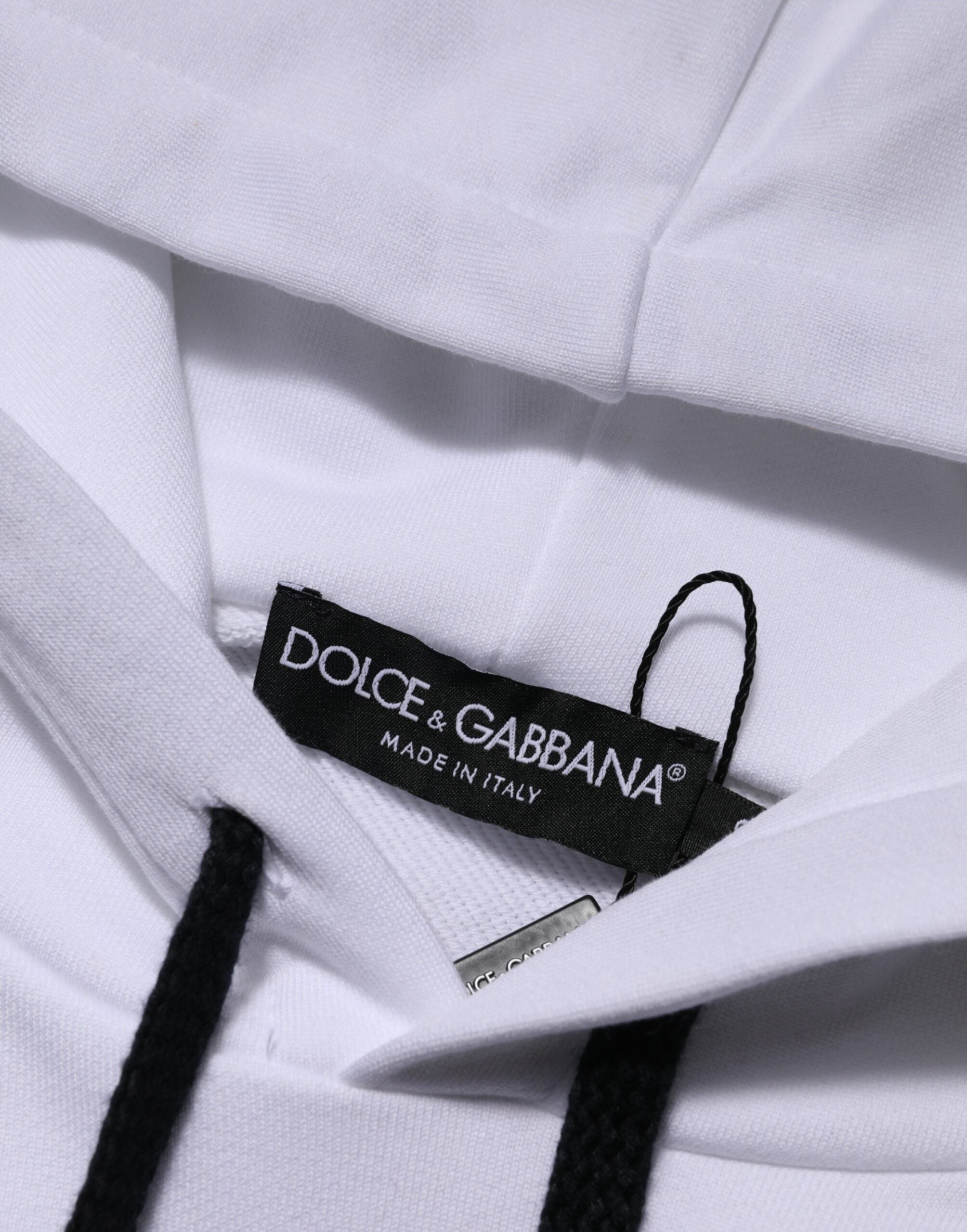 Elevate your wardrobe with the Dolce & Gabbana White Sacred Heart Hooded Sweatshirt, crafted from premium cotton, embodying exquisite Italian artistry and timeless elegance.