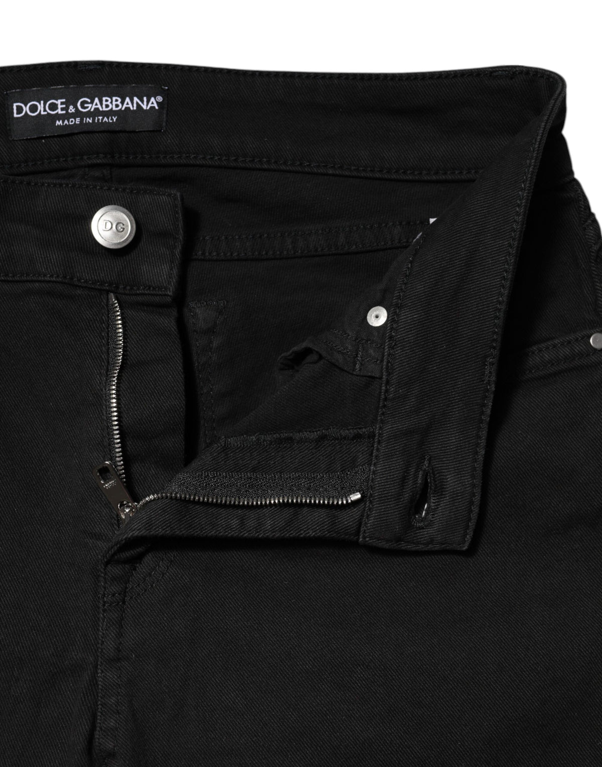 Experience the exquisite allure of Dolce & Gabbana's Black Cotton Skinny Mid Waist Denim Jeans, where Italian craftsmanship meets timeless elegance for a luxurious wardrobe staple.