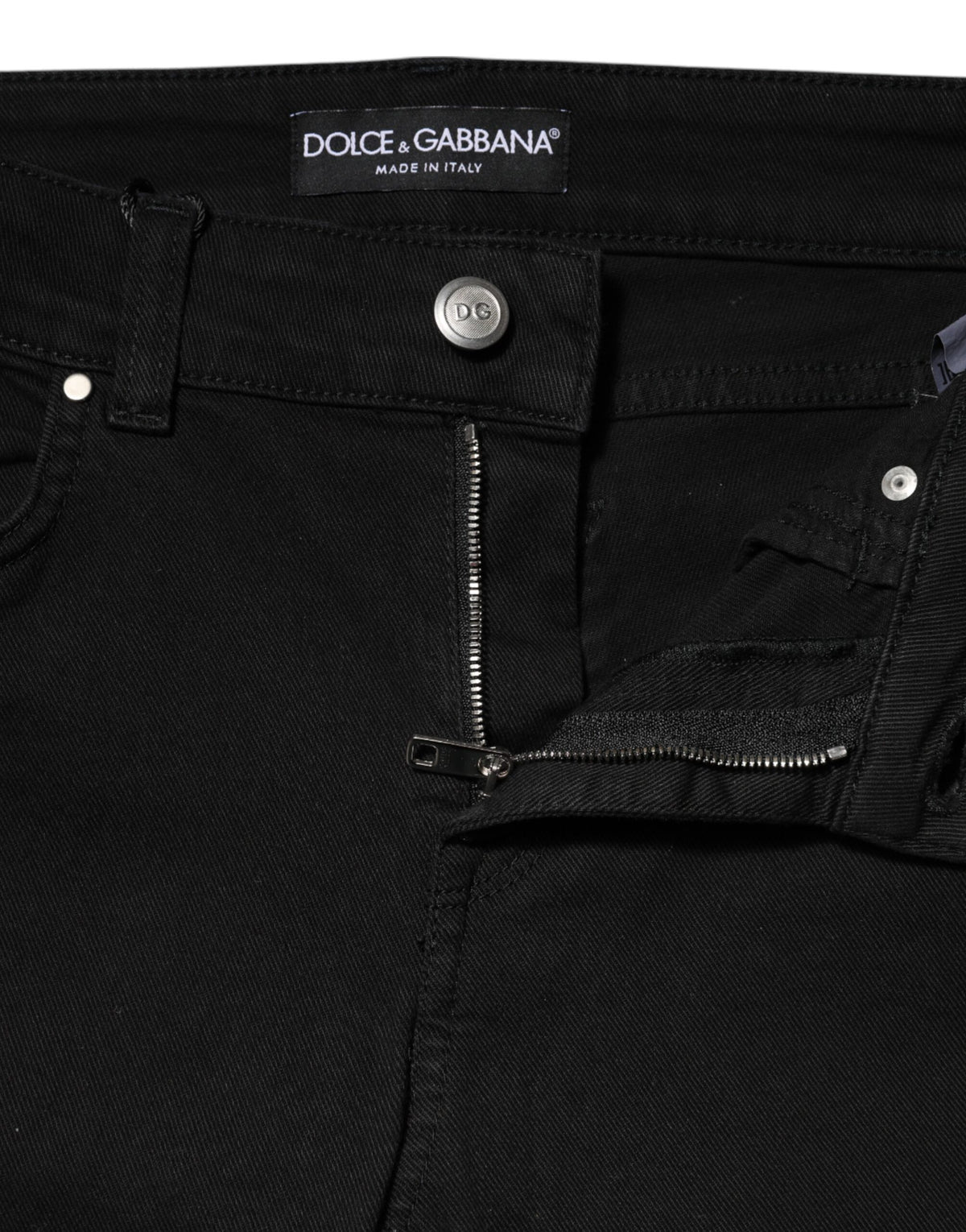 Indulge in the elegance of Dolce & Gabbana's Black Cotton Skinny Mid Waist Denim Jeans, crafted in Italy for those who embody sophistication and timeless style.