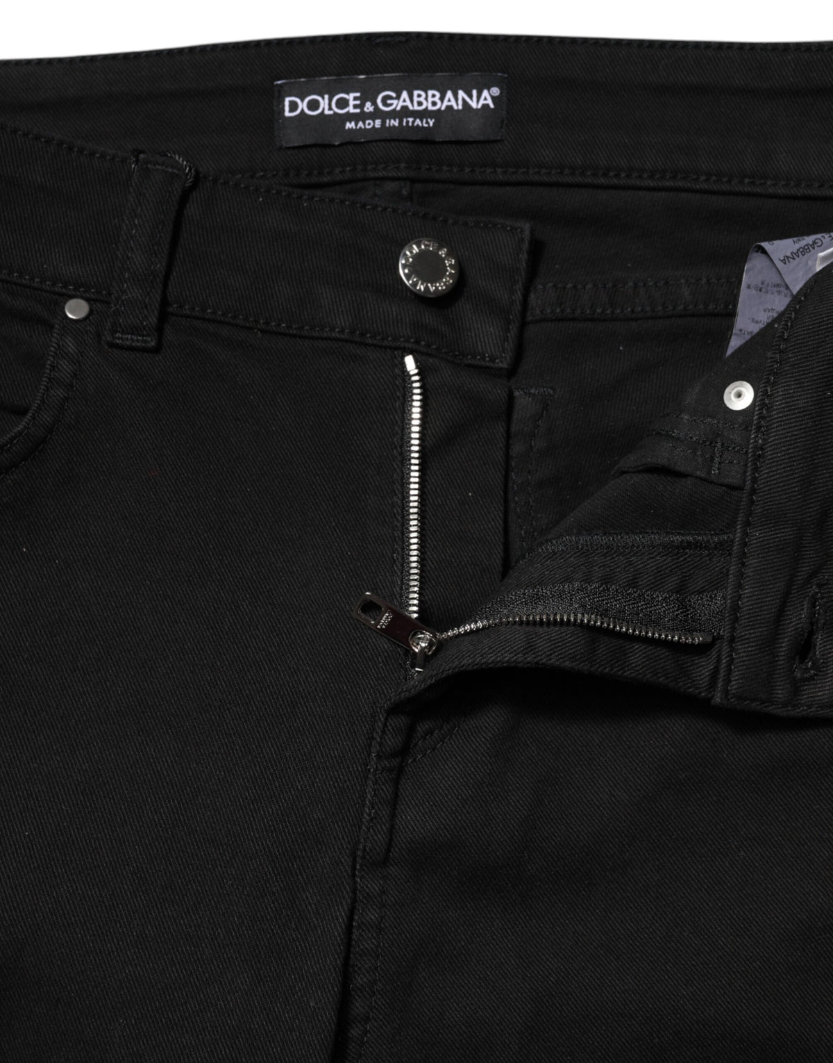 Elevate your wardrobe with Dolce & Gabbana's Black Cotton Skinny Mid Waist Denim Jeans, crafted in Italy for unparalleled luxury and comfort that embodies sophistication.