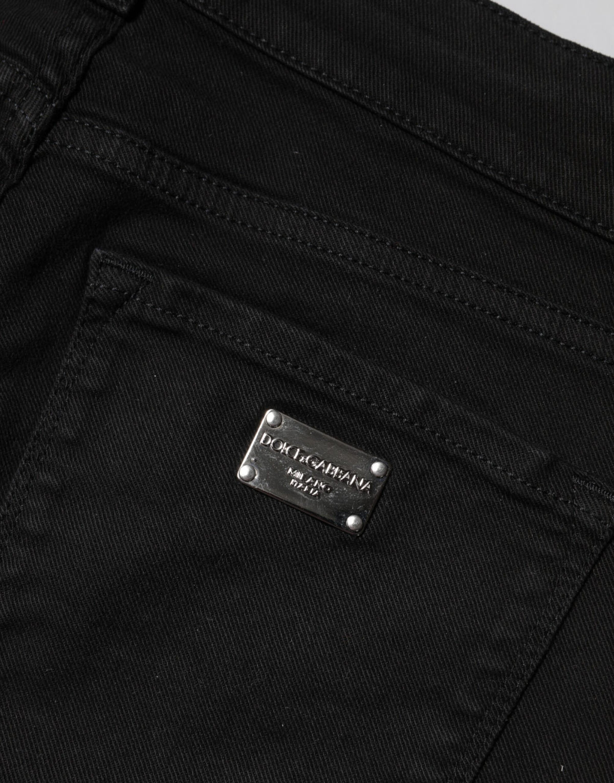Indulge in the elegance of Dolce & Gabbana's Black Cotton Skinny Mid Waist Denim Jeans, crafted in Italy for a luxurious fit that enhances your silhouette and embodies refined sophistication.