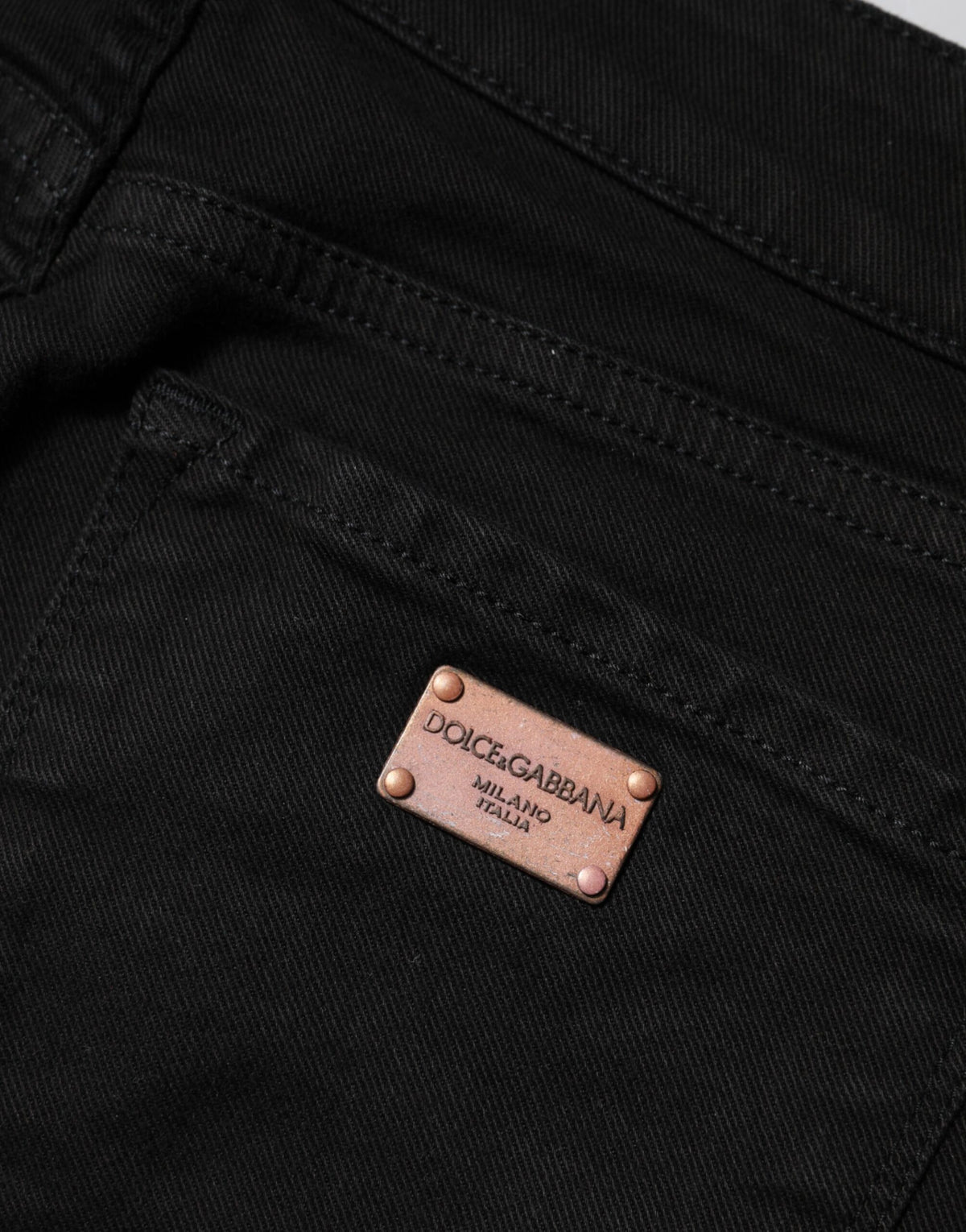 Elevate your wardrobe with Dolce & Gabbana's Black Cotton Skinny Mid Waist Denim Jeans, a luxurious blend of comfort and elegance crafted for the discerning individual.