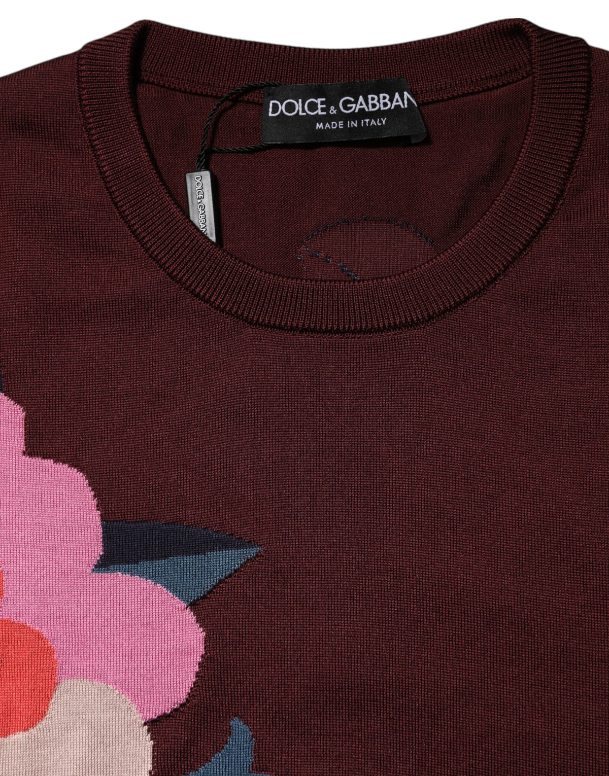 Indulge in the exquisite allure of the Dolce & Gabbana Maroon Floral Silk Crew Neck Blouse, a timeless piece embodying Italian craftsmanship and haute couture elegance.