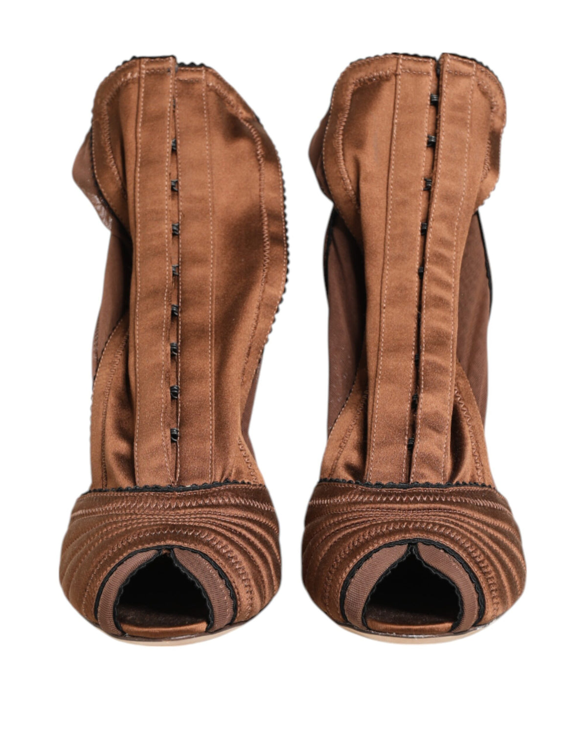Indulge in the exquisite Dolce & Gabbana Brown Bette High Heeled Ankle Boots, where luxurious silk and calfskin craftsmanship elevate your style to new heights of sophistication.