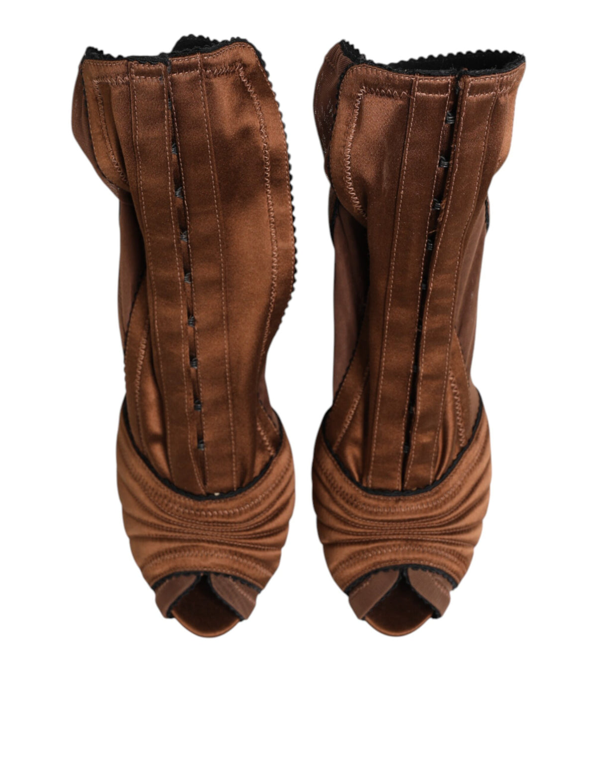 Indulge in the exquisite Dolce & Gabbana Brown Bette High Heeled Ankle Boots, where luxurious silk and calfskin craftsmanship elevate your style to new heights of sophistication.