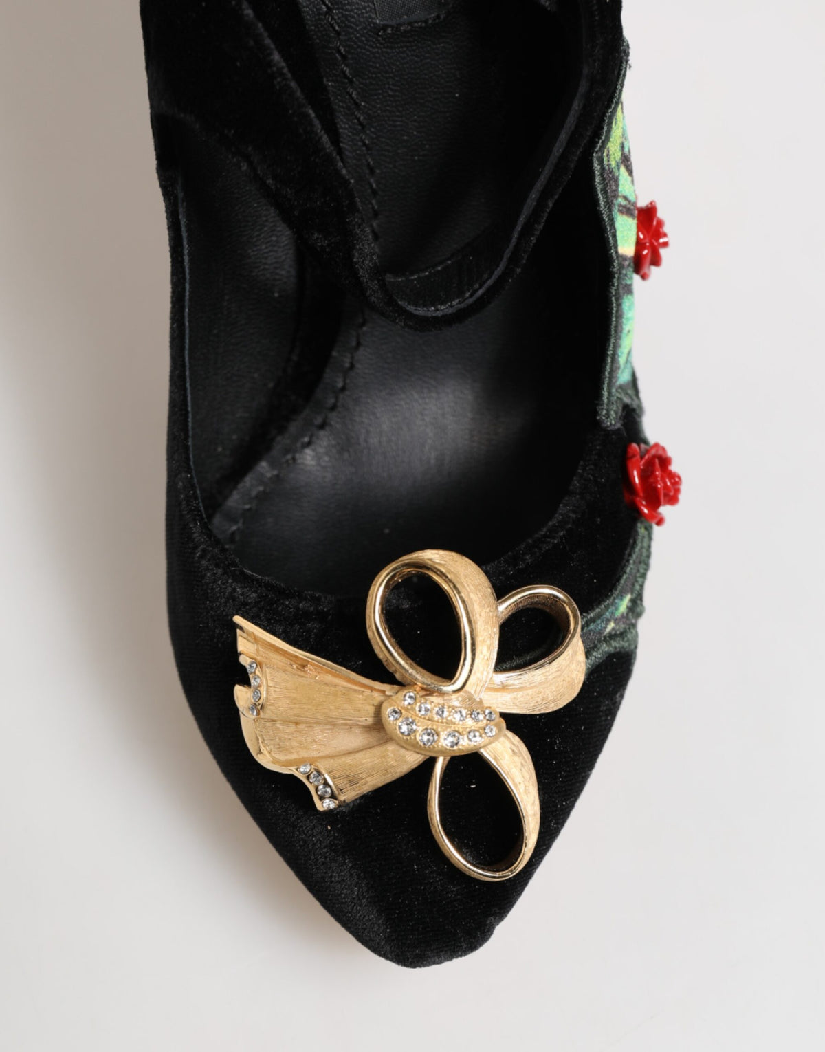 Step into timeless elegance with Dolce & Gabbana's Black Roses Crystal Brooch Mary Jane Shoes, crafted from luxurious rayon and silk for the discerning connoisseur.