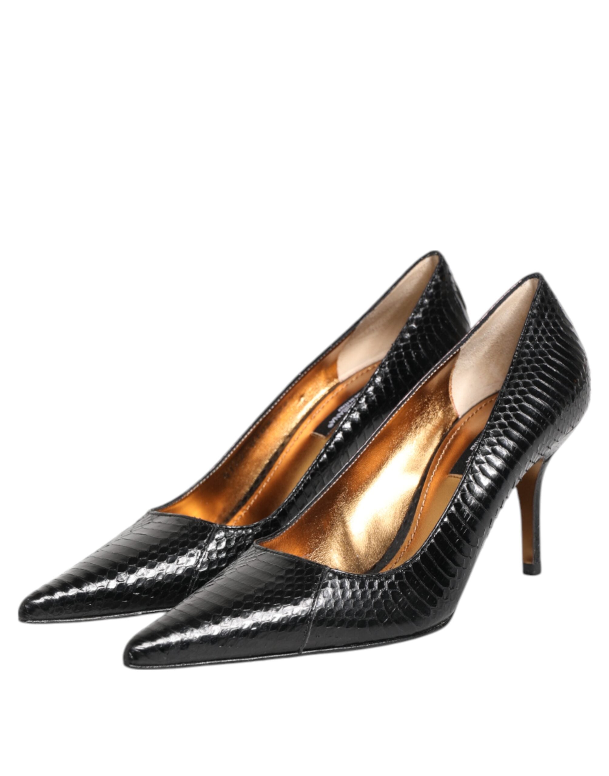 Elevate your elegance with Dolce & Gabbana's Black Exotic Leather Stiletto Pumps, crafted from luxurious python leather for a statement of refined sophistication.