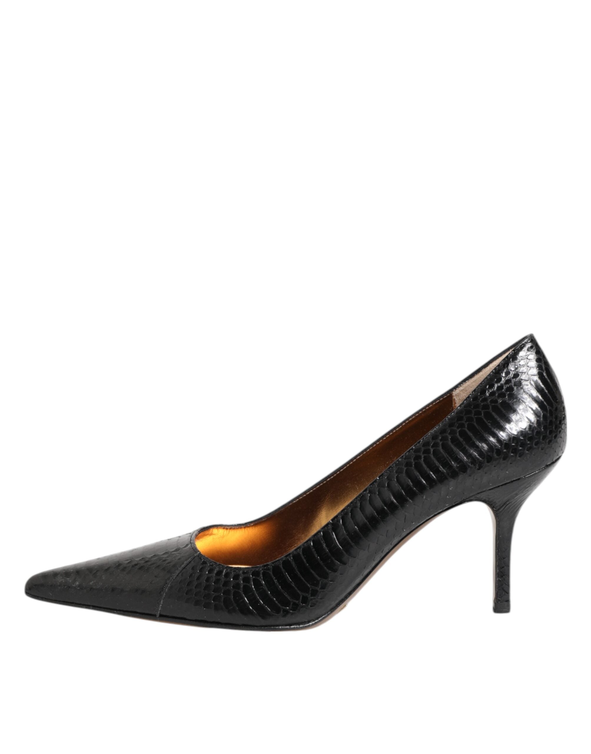Indulge in the exquisite allure of Dolce & Gabbana's Black Exotic Leather Stiletto Pumps, crafted from luxurious python leather for timeless elegance and sophistication.