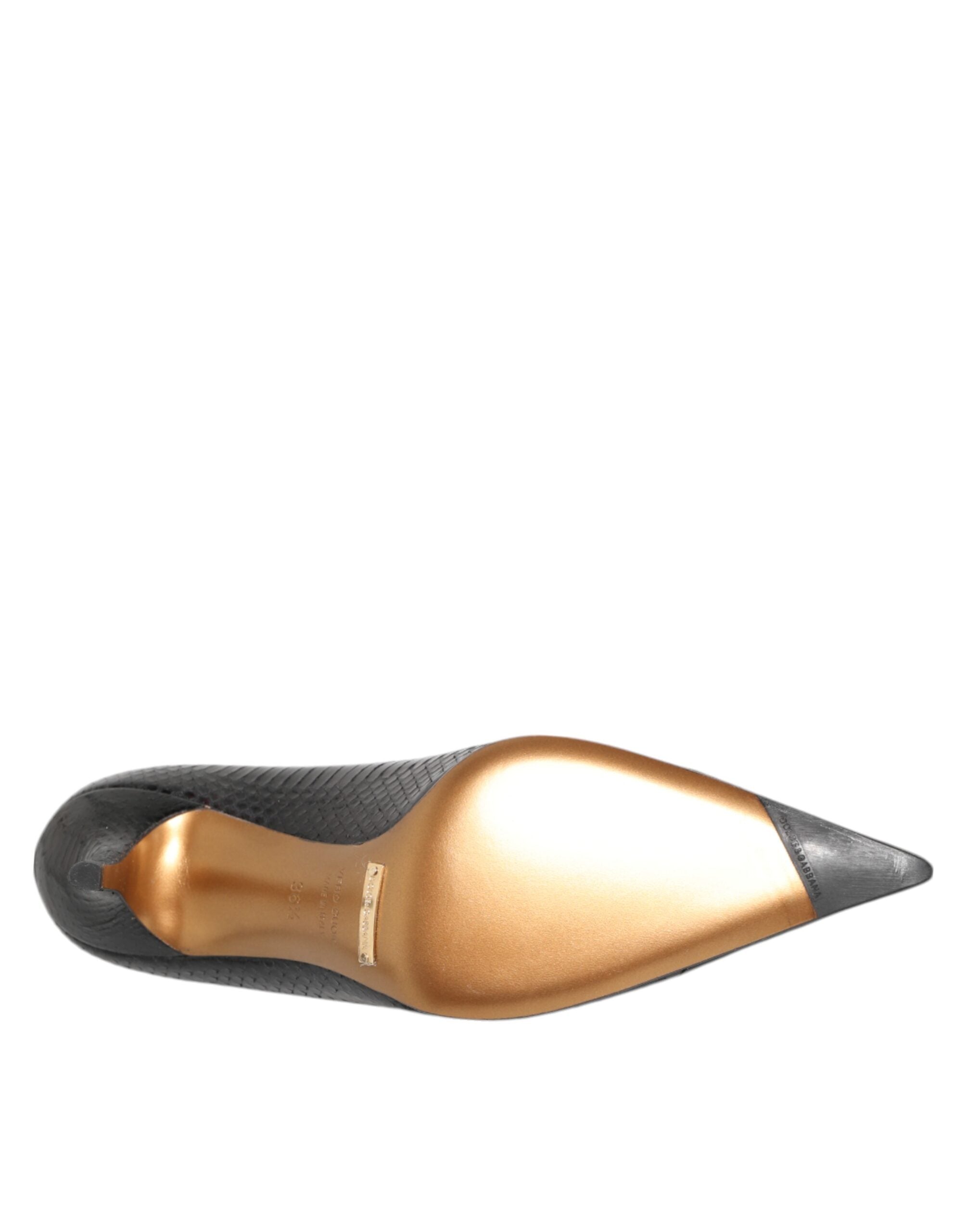 Elevate your elegance with Dolce & Gabbana's Black Exotic Leather Stiletto Pumps, crafted from luxurious python leather for a statement of refined sophistication.