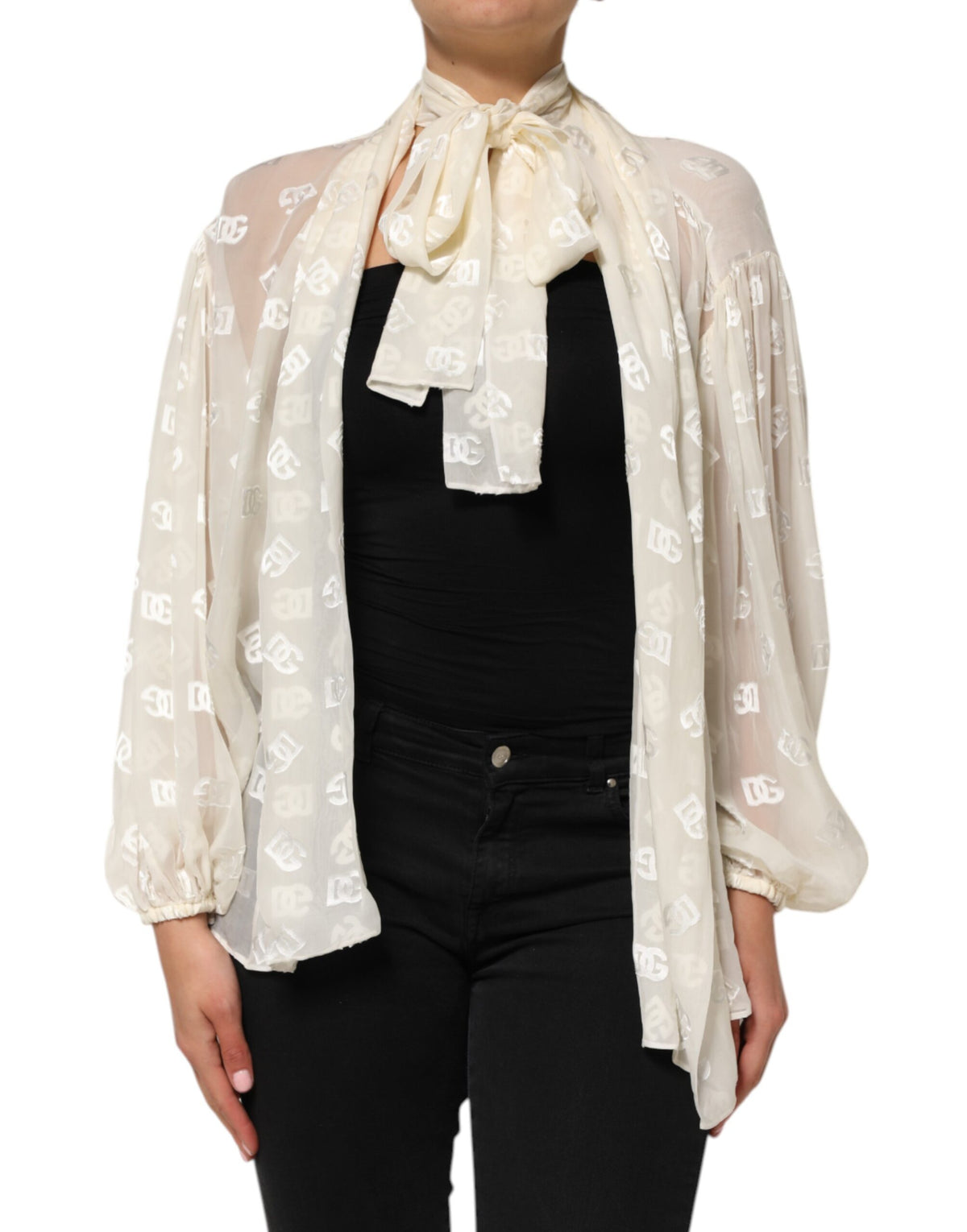 Indulge in the exquisite Dolce & Gabbana Off White Logo Monogram Ascot Collar Top, a masterpiece of silk and viscose that embodies timeless elegance and sophisticated allure.