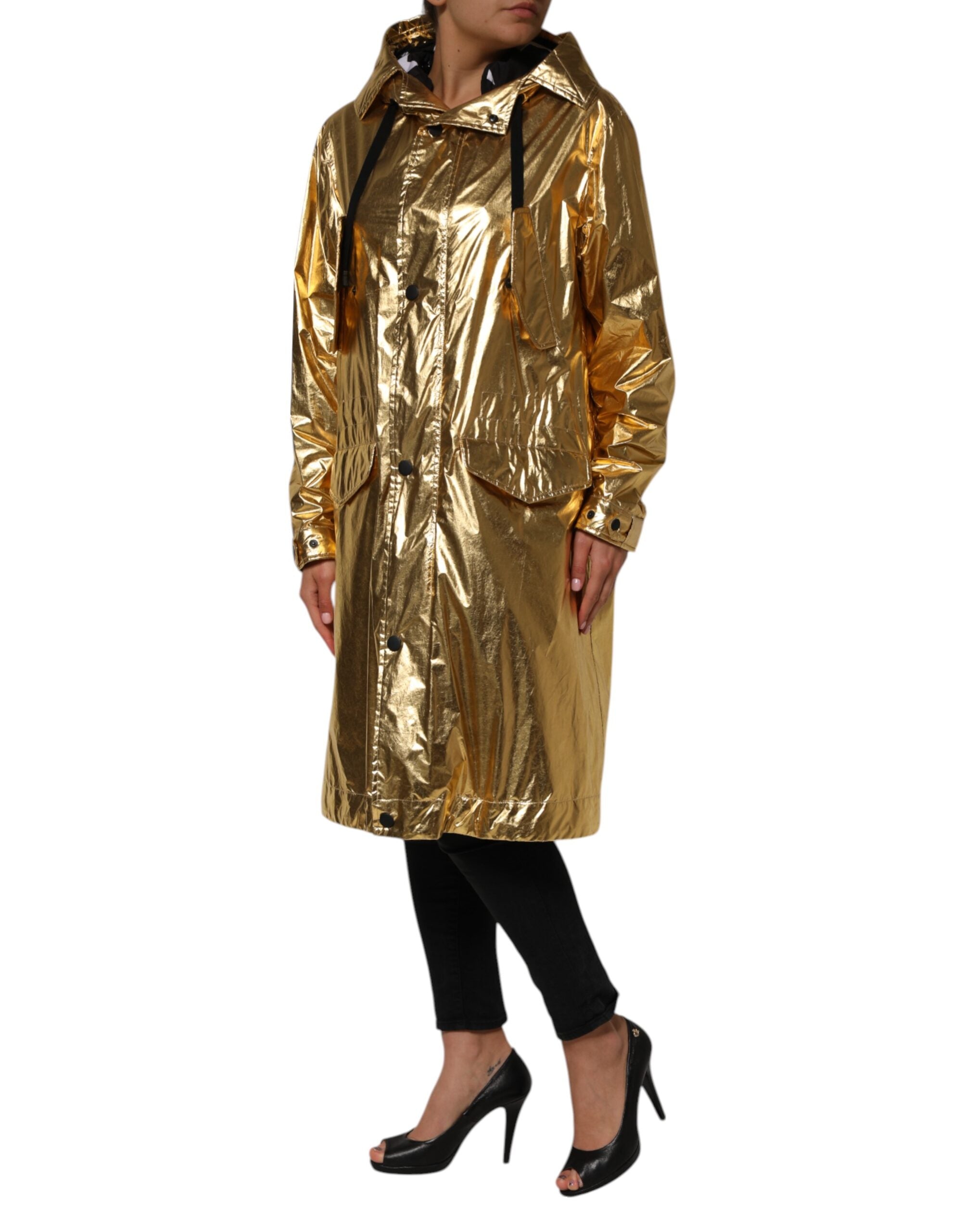 Elevate your wardrobe with the Dolce & Gabbana Gold Hooded Long Sleeves Trench Coat, a masterpiece of Italian craftsmanship that embodies timeless luxury and sophistication.
