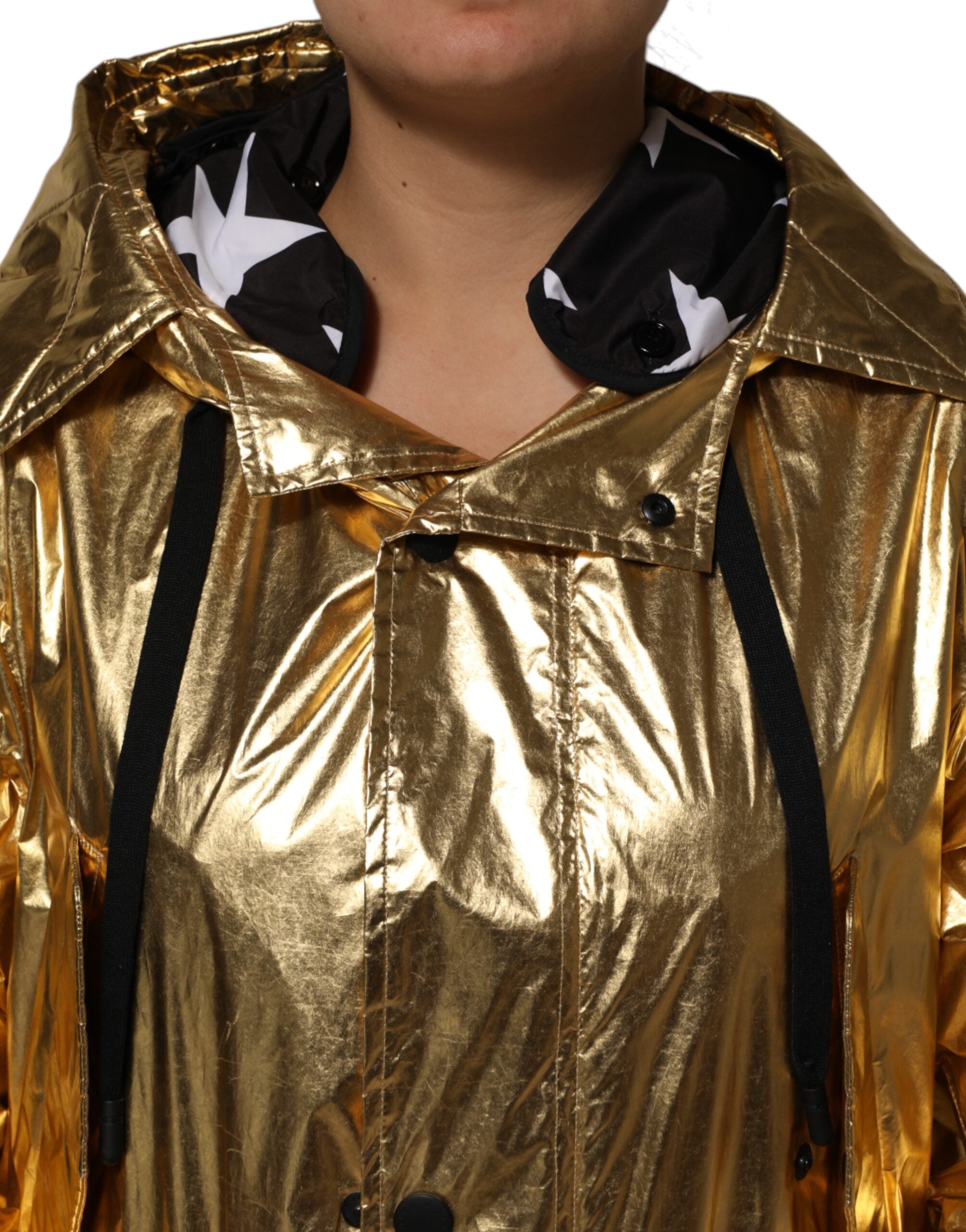 Indulge in the exquisite Dolce & Gabbana Gold Hooded Long Sleeves Trench Coat, a masterpiece of Italian craftsmanship that radiates timeless luxury and sophistication.