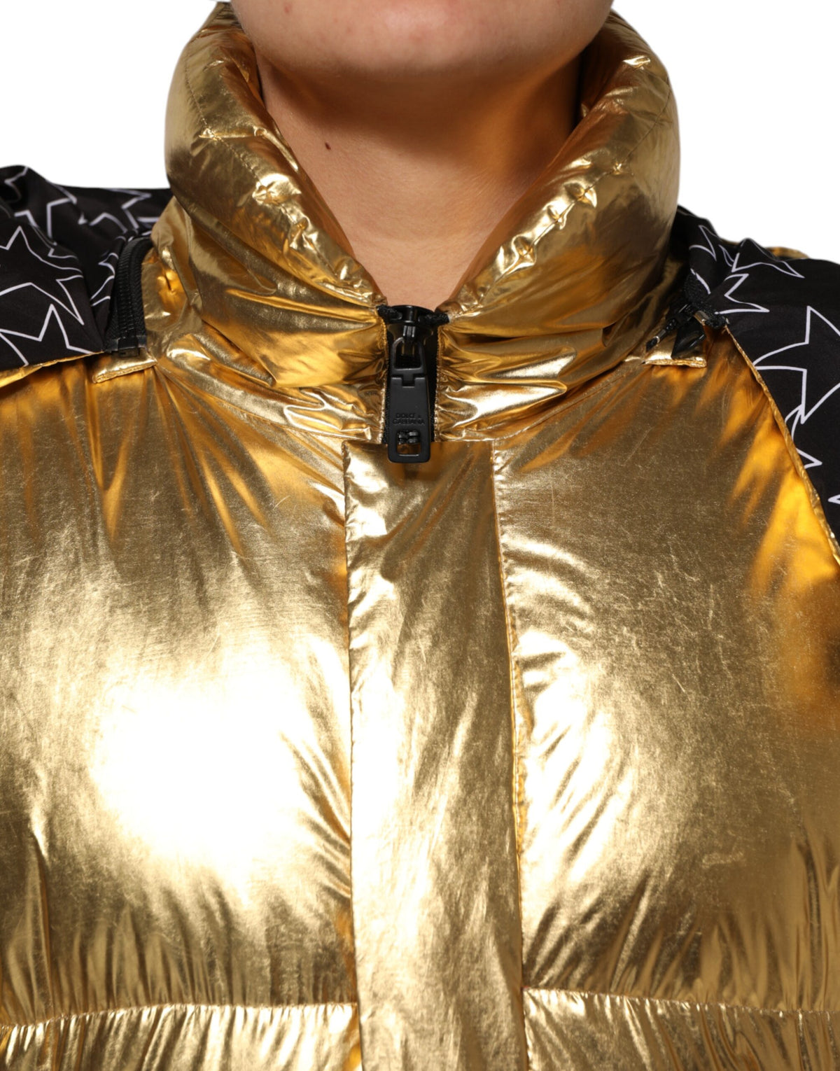 Elevate your wardrobe with the Dolce & Gabbana Gold Hooded Puffer Jacket, a masterpiece of Italian craftsmanship blending luxury and contemporary elegance for the discerning individual.