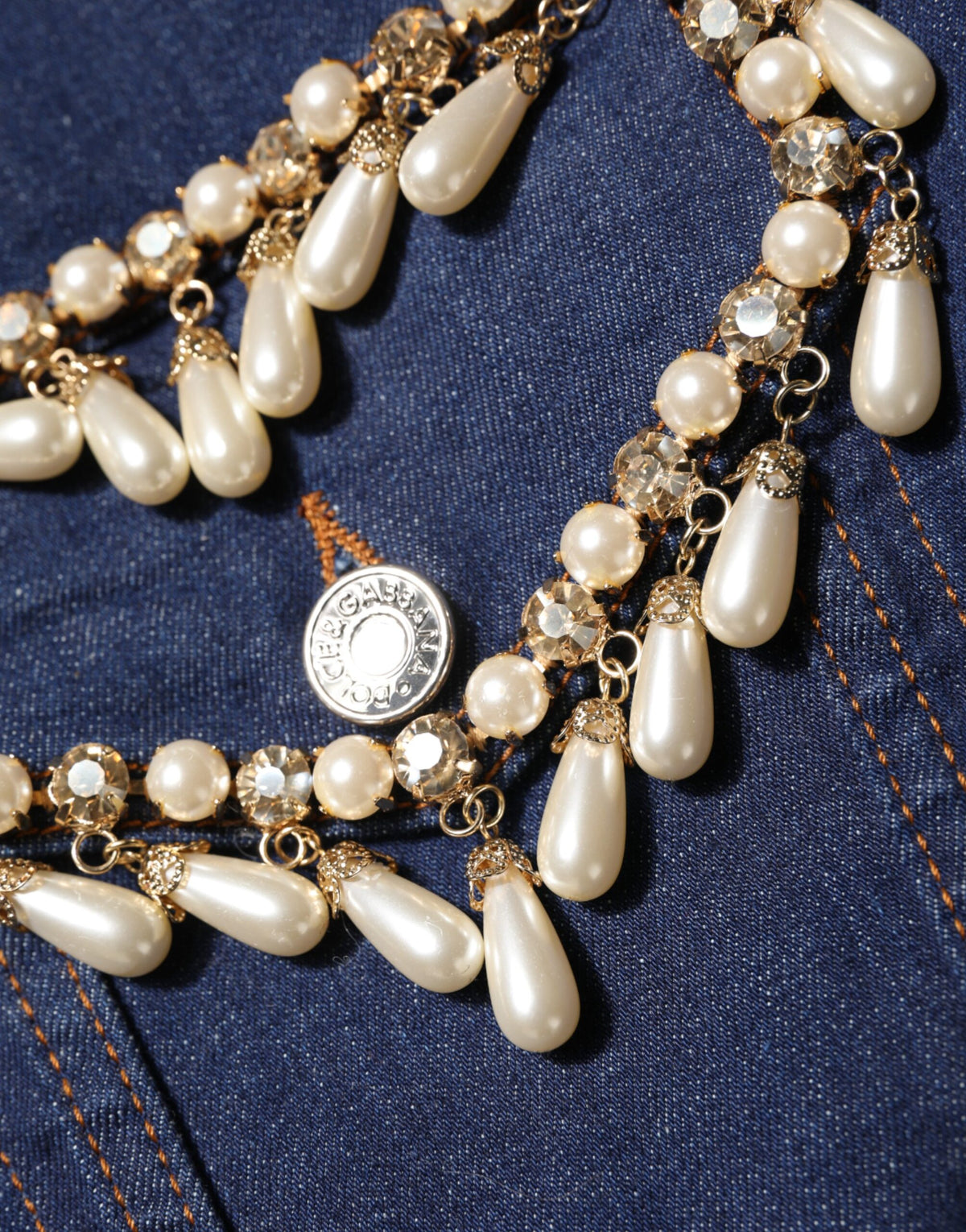 Indulge in the exquisite Dolce & Gabbana Blue Cotton Denim Crystal Embellished Jacket, where luxurious craftsmanship meets timeless elegance for the discerning individual.