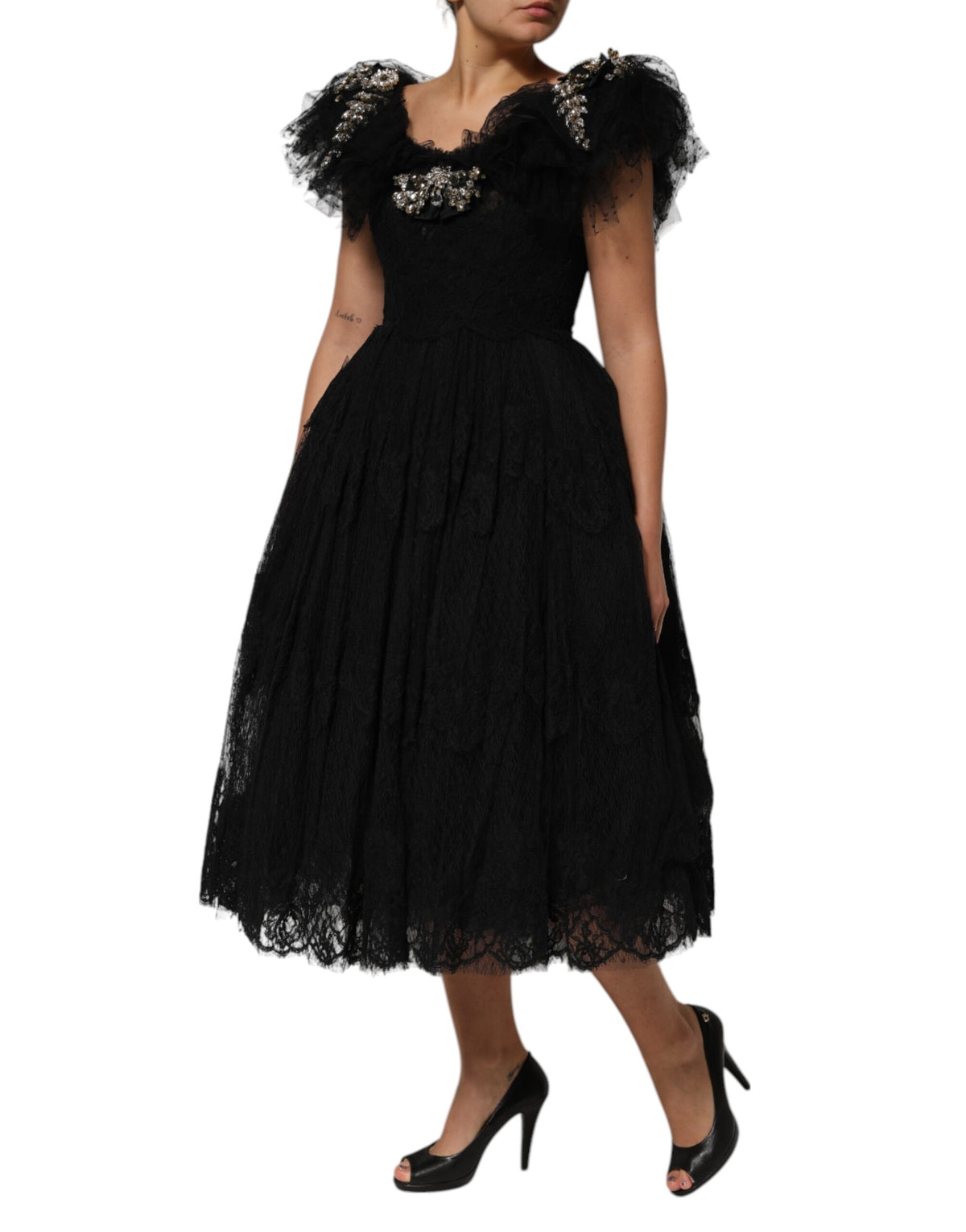 Indulge in the exquisite Dolce & Gabbana Black Crystal Embellished Midi A-line Dress, crafted in Italy from luxurious materials, embodying timeless elegance for the discerning individual.