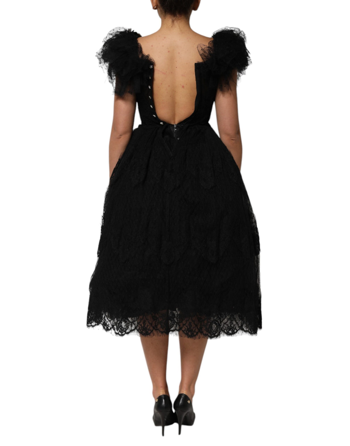 Indulge in the Dolce & Gabbana Black Crystal Embellished Midi A-line Dress, a masterpiece of Italian craftsmanship that exudes timeless elegance and allure.