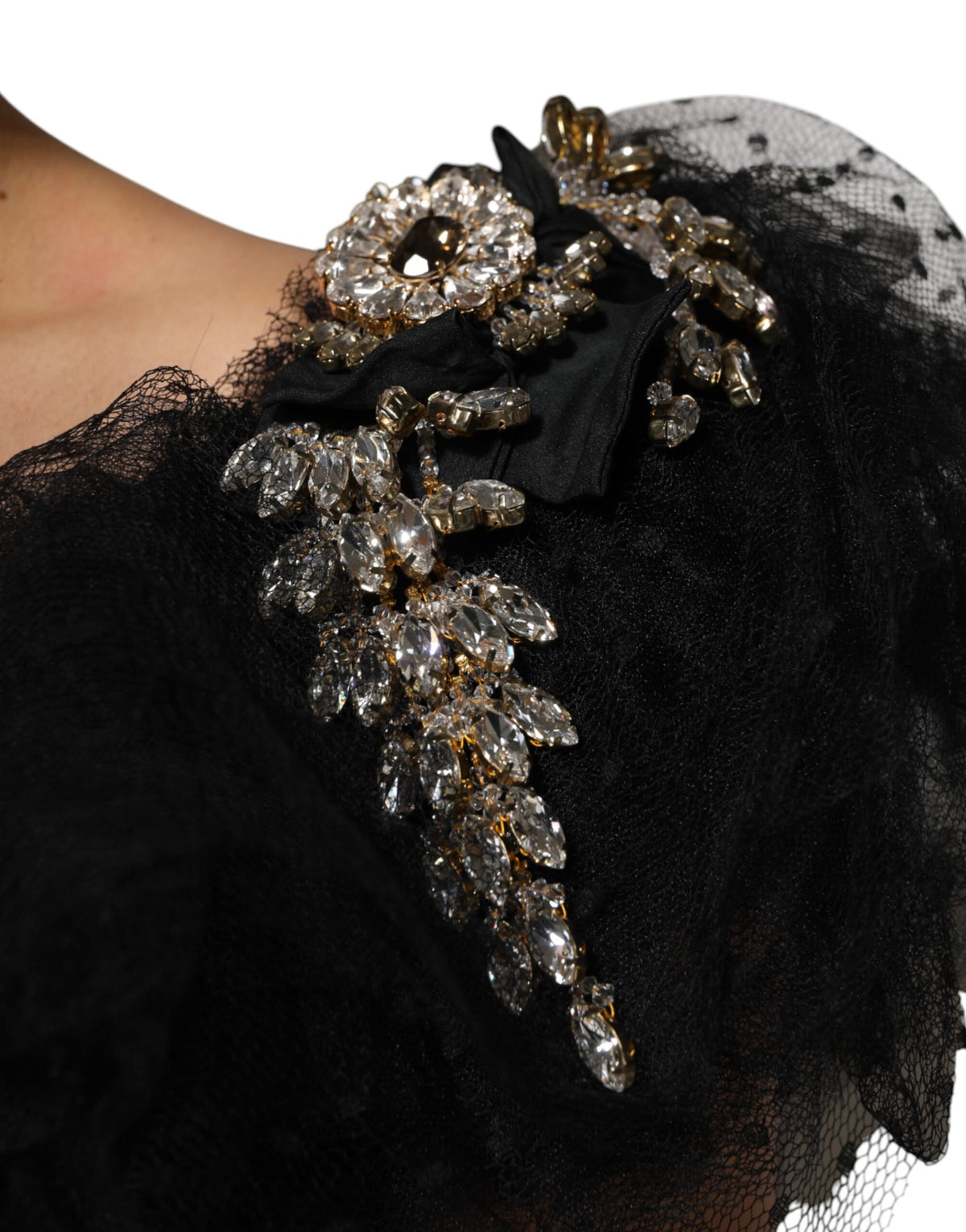 Indulge in the Dolce & Gabbana Black Crystal Embellished Midi A-line Dress, a testament to Italian craftsmanship, where luxurious materials meet timeless elegance for the discerning individual.