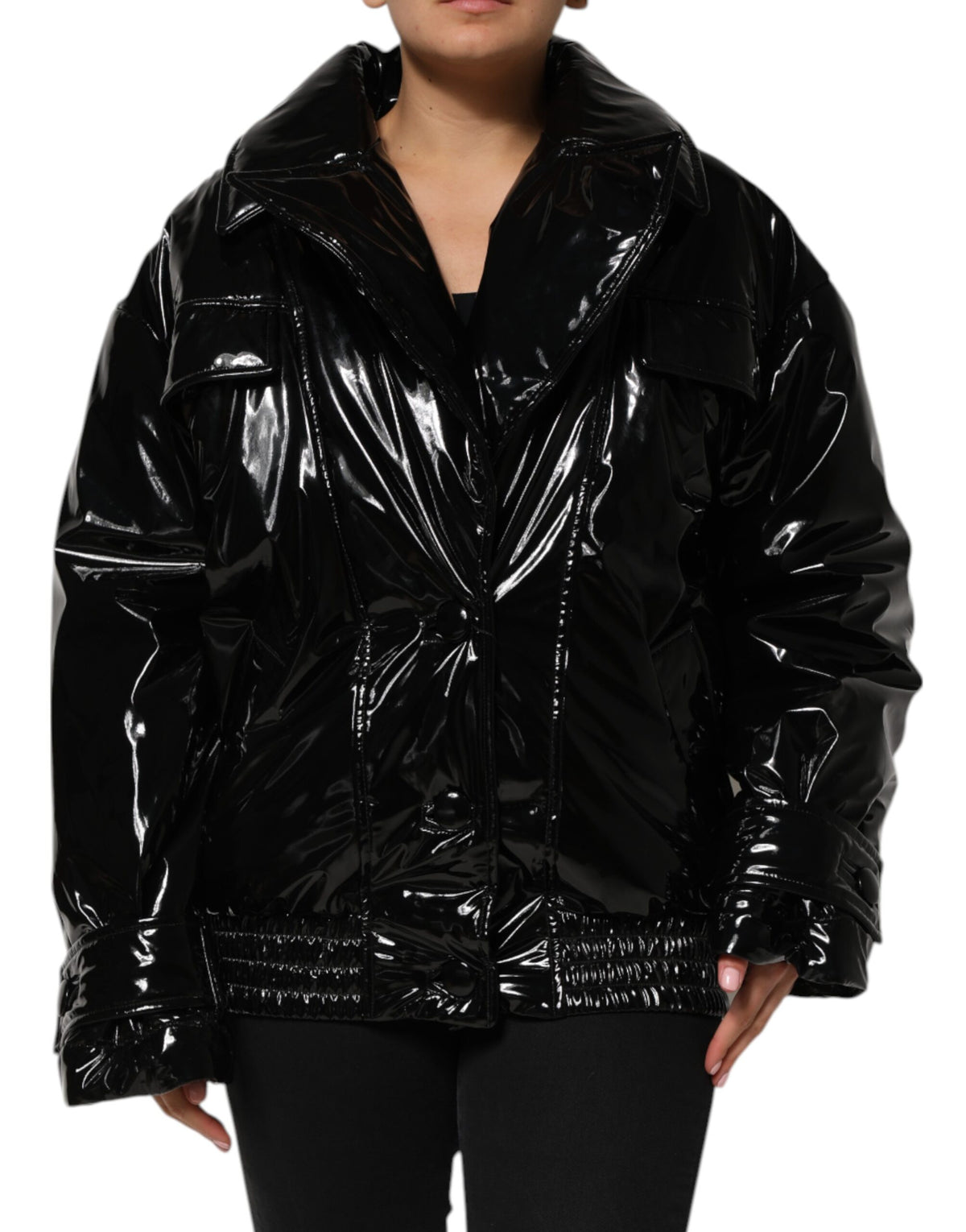 Indulge in the exquisite Dolce & Gabbana Black Polyester Quilted Puffer Coat, a masterpiece of Italian craftsmanship that elevates your style with luxurious warmth and sophistication.