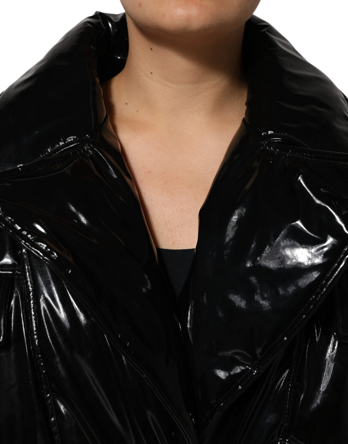 Indulge in the exquisite Dolce & Gabbana Black Polyester Quilted Puffer Coat, a masterpiece of Italian craftsmanship that elevates your style with luxurious warmth and sophistication.