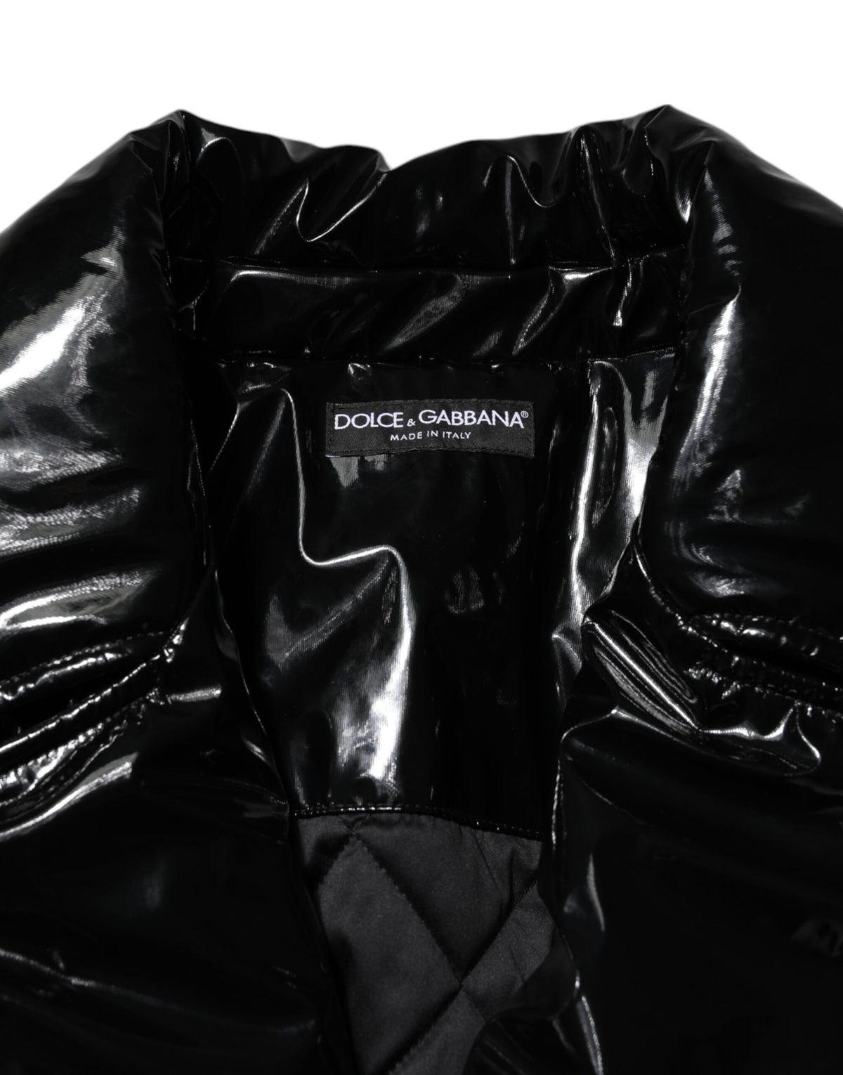 Experience the exquisite Dolce & Gabbana Black Polyester Quilted Puffer Coat, where Italian craftsmanship meets luxurious design, perfect for every sophisticated occasion.
