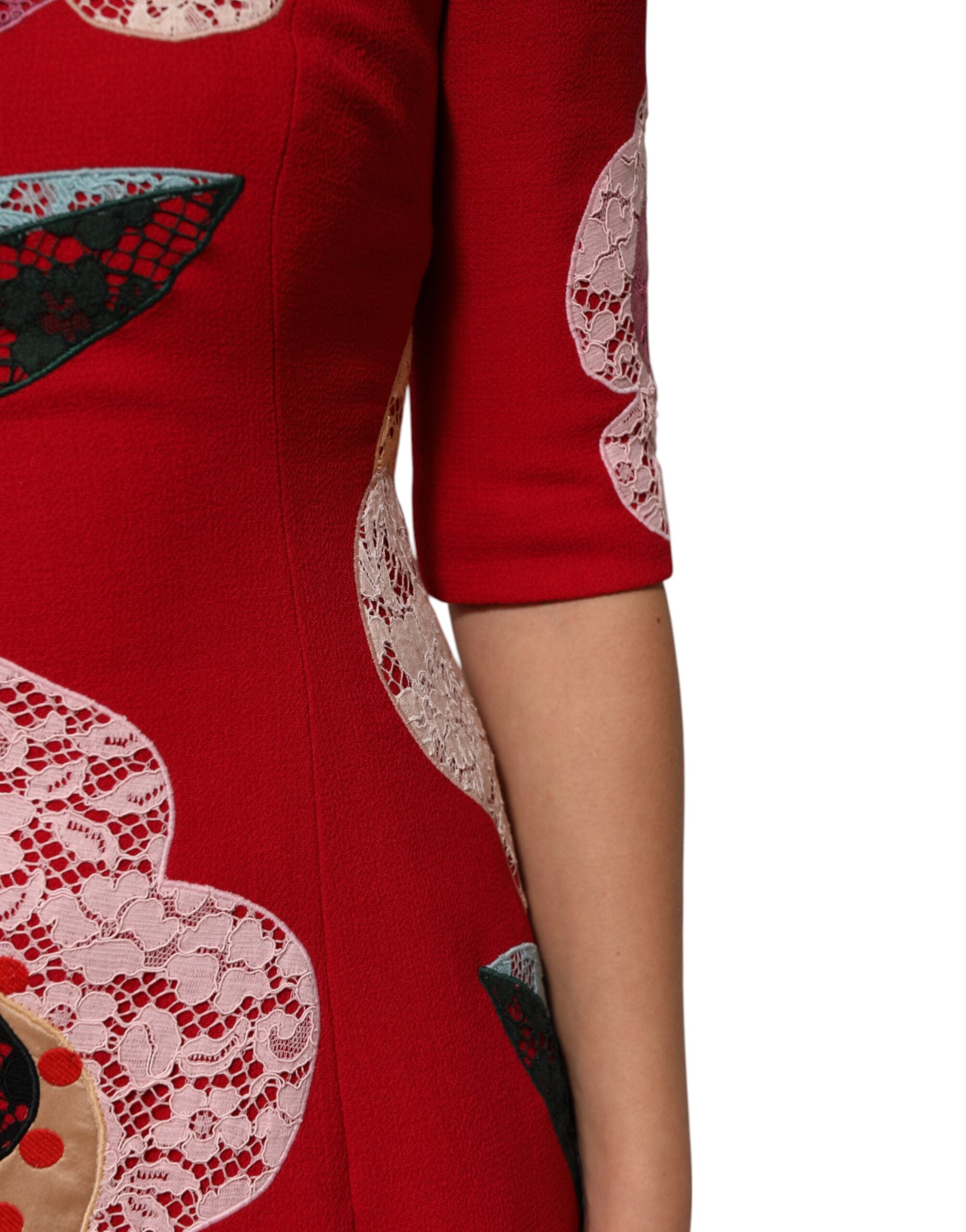Elevate your wardrobe with the Dolce & Gabbana Red Lace Floral Applique A-line Mini Dress, a masterpiece of luxurious wool and silk, embodying timeless elegance and sensual allure.