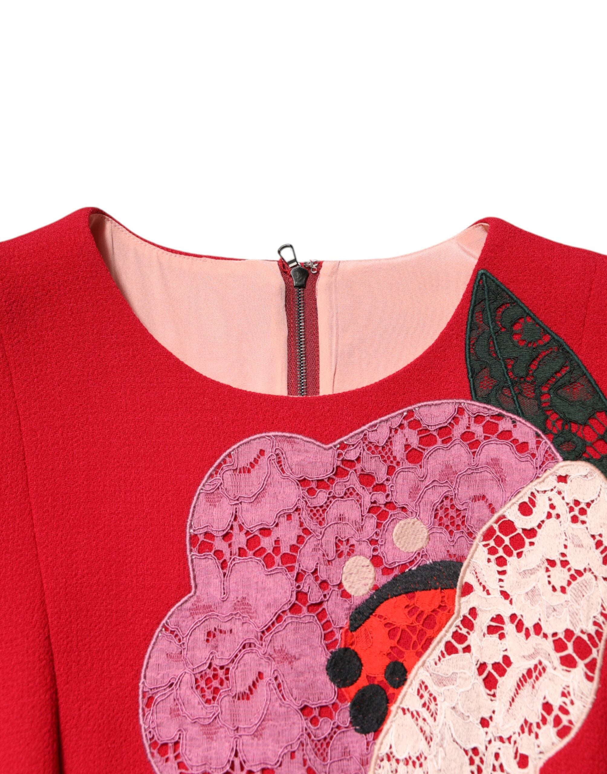 Experience the opulence of the Dolce & Gabbana Red Lace Floral Applique A-line Mini Dress, a masterpiece of haute couture crafted from luxurious wool and silk, perfect for those who embody elegance and allure.