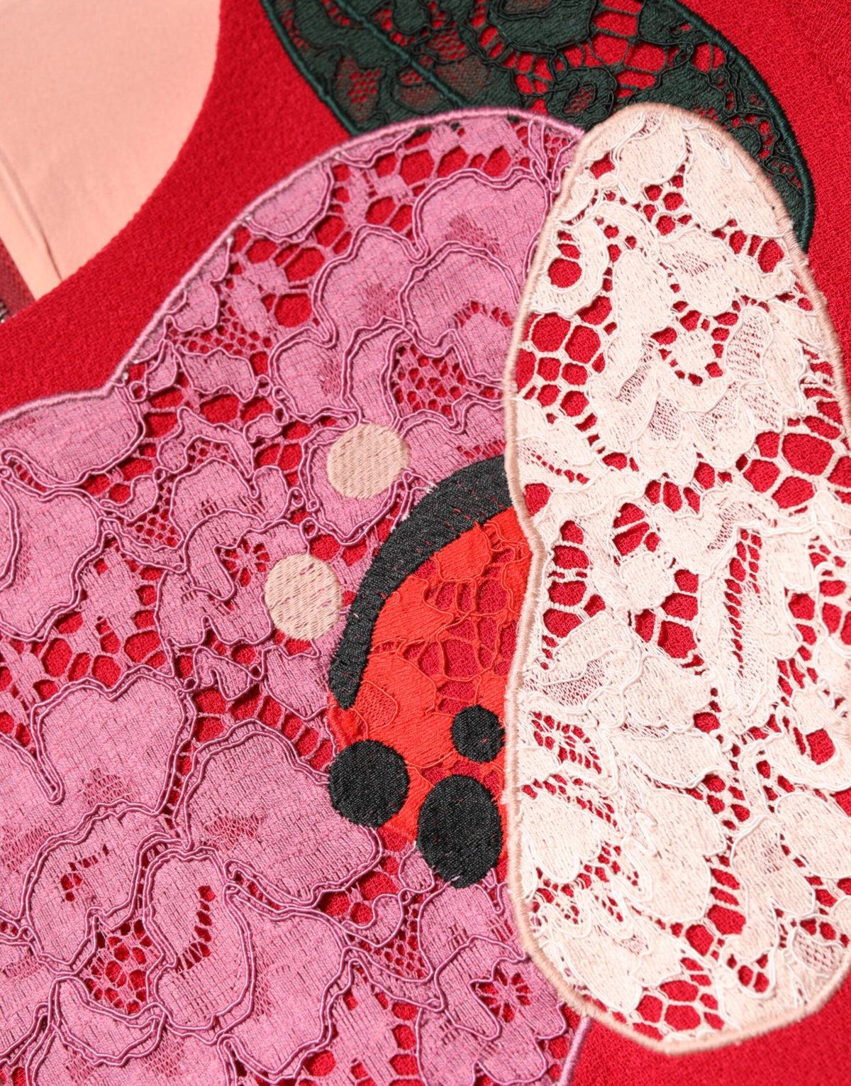 Indulge in the opulent allure of the Dolce & Gabbana Red Lace Floral Applique A-line Mini Dress, a masterpiece of luxurious wool and silk that redefines haute couture elegance.