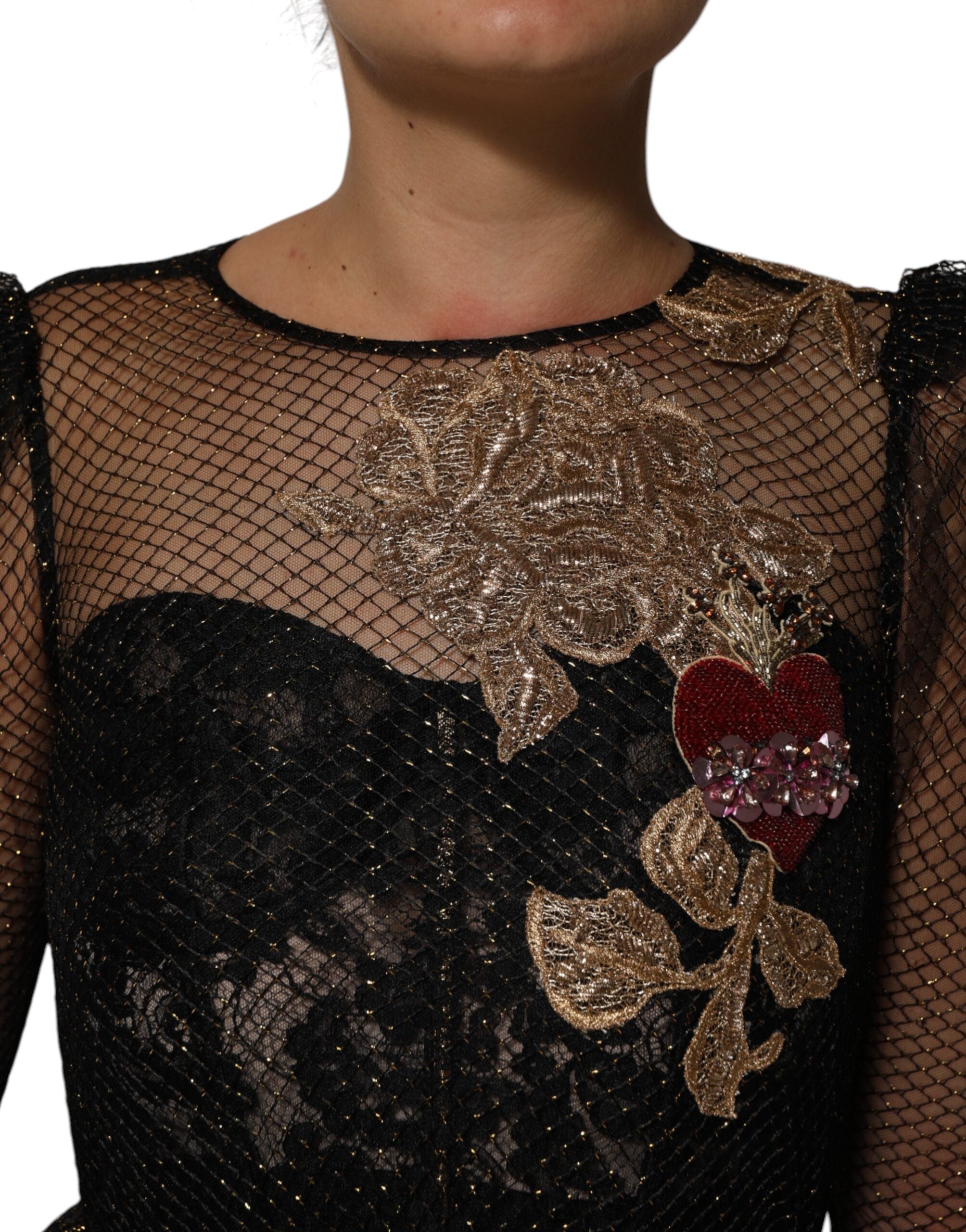 Elevate your wardrobe with the Dolce & Gabbana Black Crystal Heart Embellished A-line Dress, a timeless masterpiece of Italian craftsmanship, adorned with luxurious silk and radiant crystals.