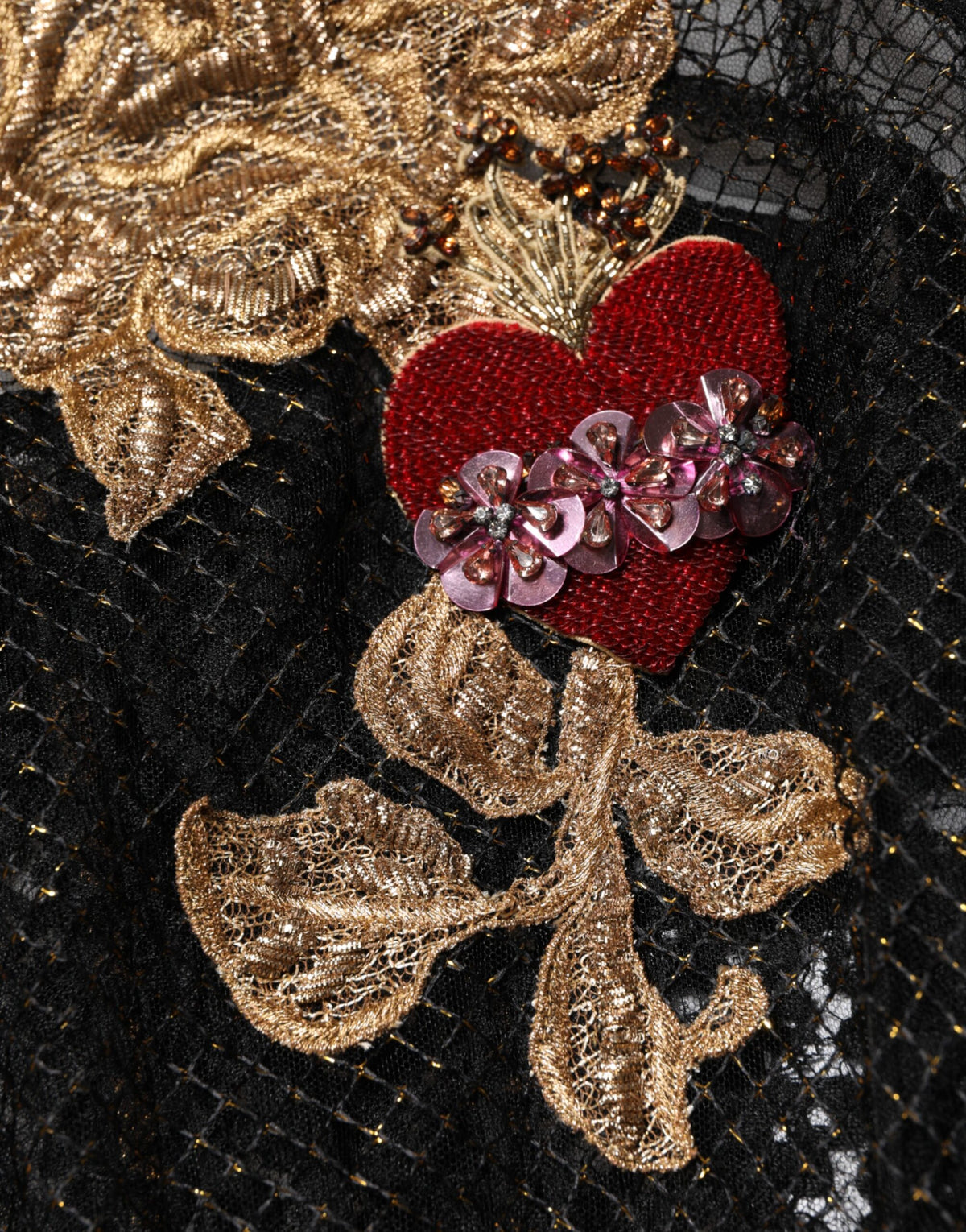 Elevate your wardrobe with the Dolce & Gabbana Black Crystal Heart Embellished A-line Dress, a timeless masterpiece of Italian craftsmanship and luxurious silk, perfect for any elegant occasion.