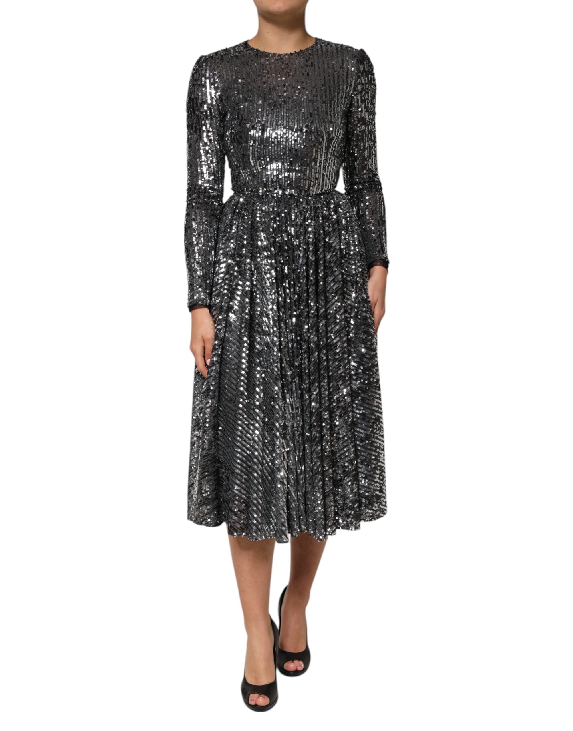 Experience the allure of the Dolce & Gabbana Black Sequined Long Sleeves Midi A-line Dress, a 2023 Haute Couture masterpiece that embodies exquisite craftsmanship and timeless elegance.