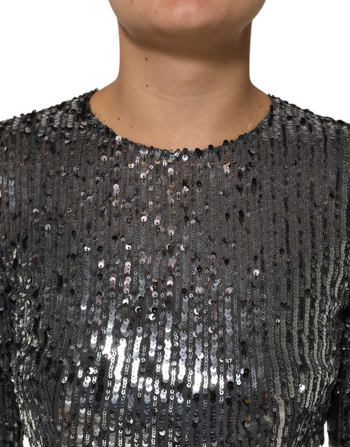 Experience the allure of the Dolce & Gabbana Black Sequined Long Sleeves Midi A-line Dress, a masterpiece of Italian craftsmanship that embodies timeless elegance and luxurious sophistication.