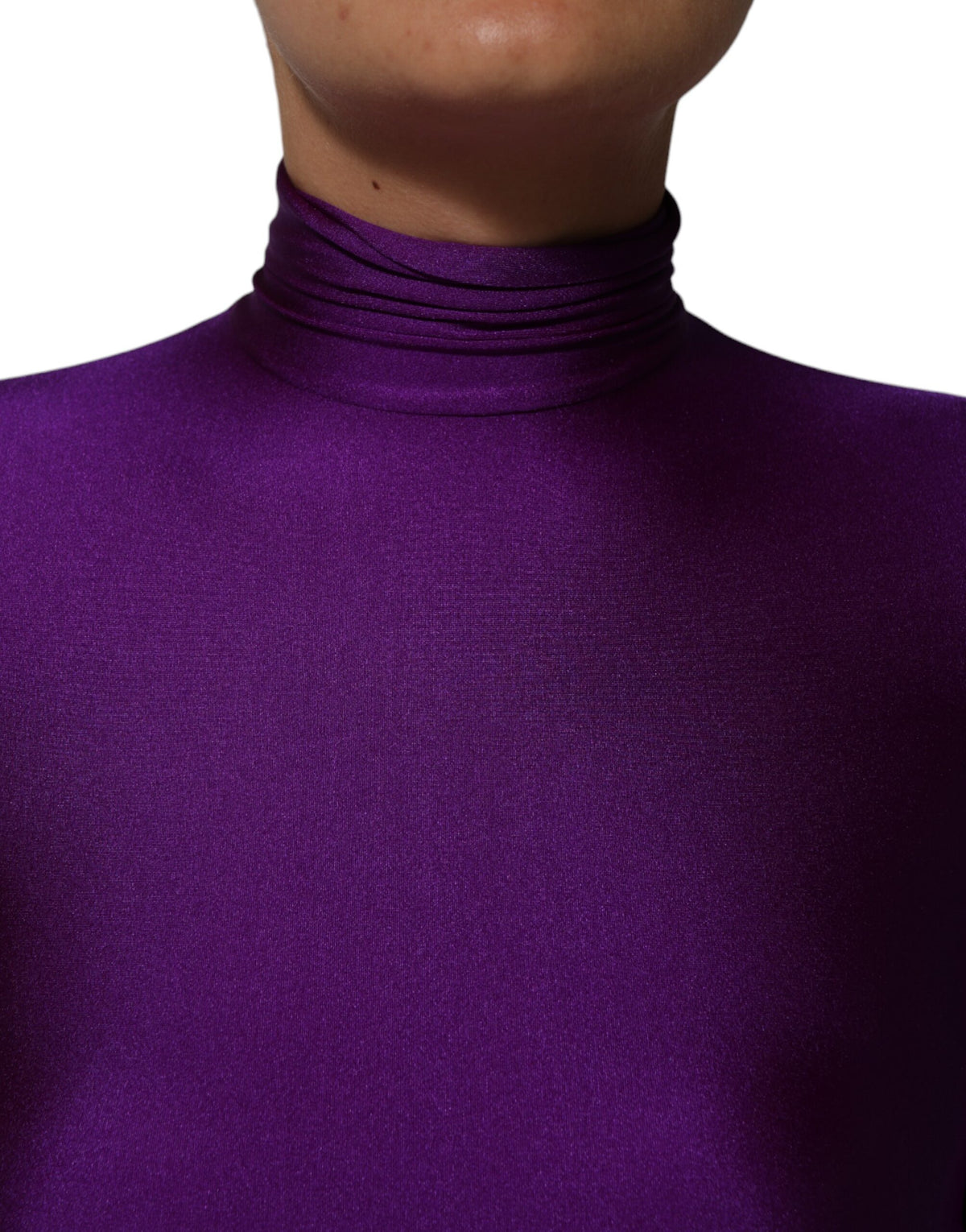 Experience the allure of the Dolce & Gabbana Purple Nylon Turtleneck Bodycon Jumpsuit Dress, where exquisite Italian craftsmanship meets luxurious elegance, perfect for the discerning individual.