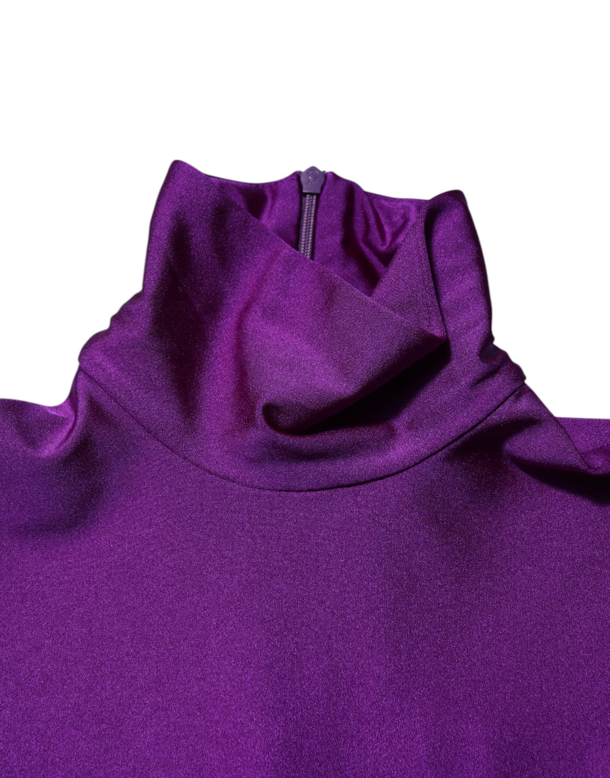 Experience the exquisite allure of the Dolce & Gabbana Purple Nylon Turtleneck Bodycon Jumpsuit Dress, crafted in Italy for those who embrace elegance and sophistication.